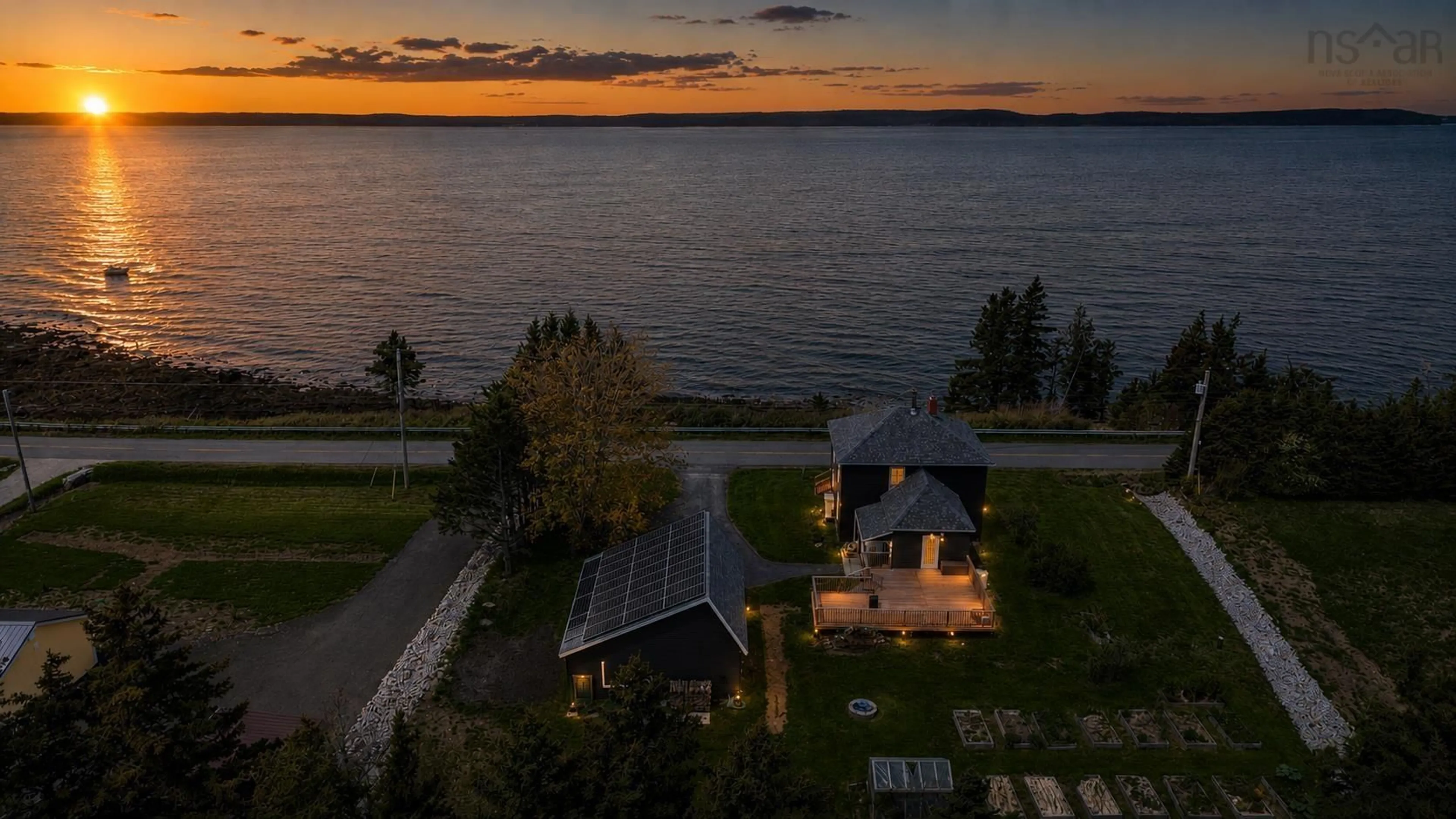 A pic from outside/outdoor area/front of a property/back of a property/a pic from drone, water/lake/river/ocean view for 650 Riverside Rd, New Edinburgh Nova Scotia B0W 3T0