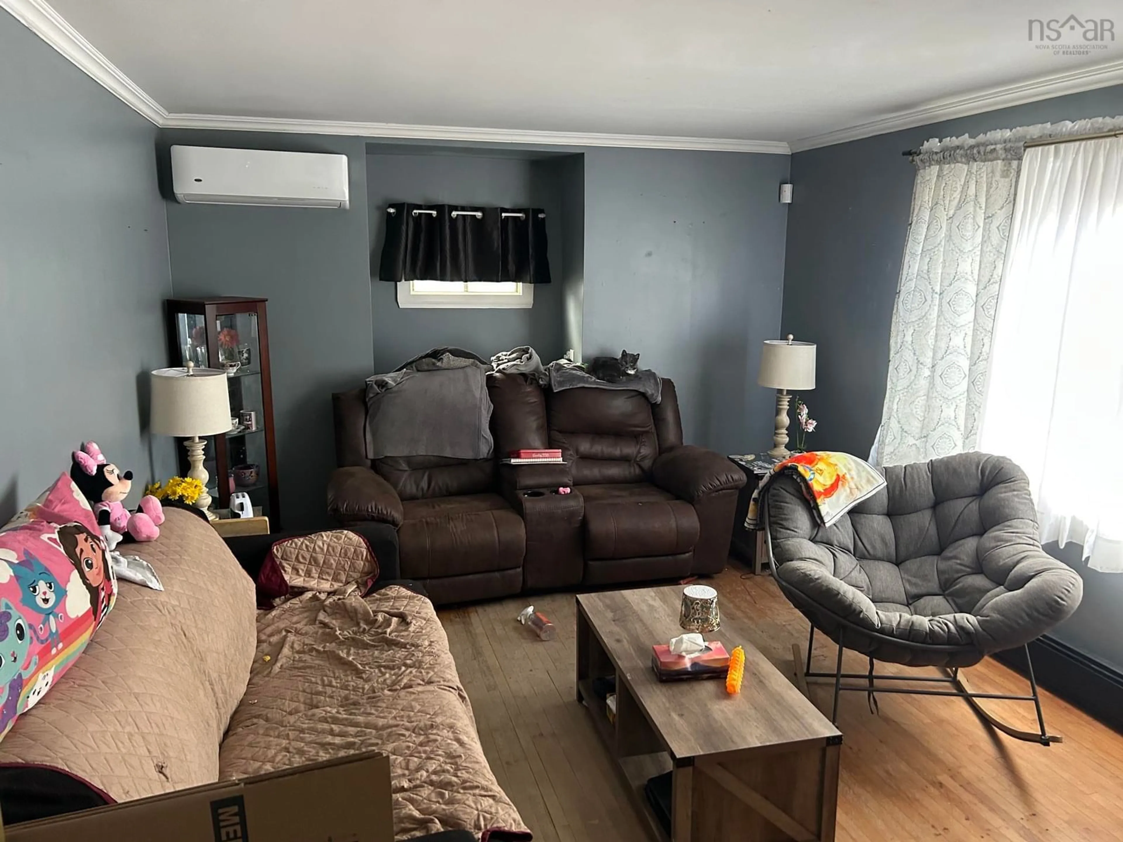 Living room with furniture, wood/laminate floor for 156 Grove St, Sydney Nova Scotia B1P 3N2