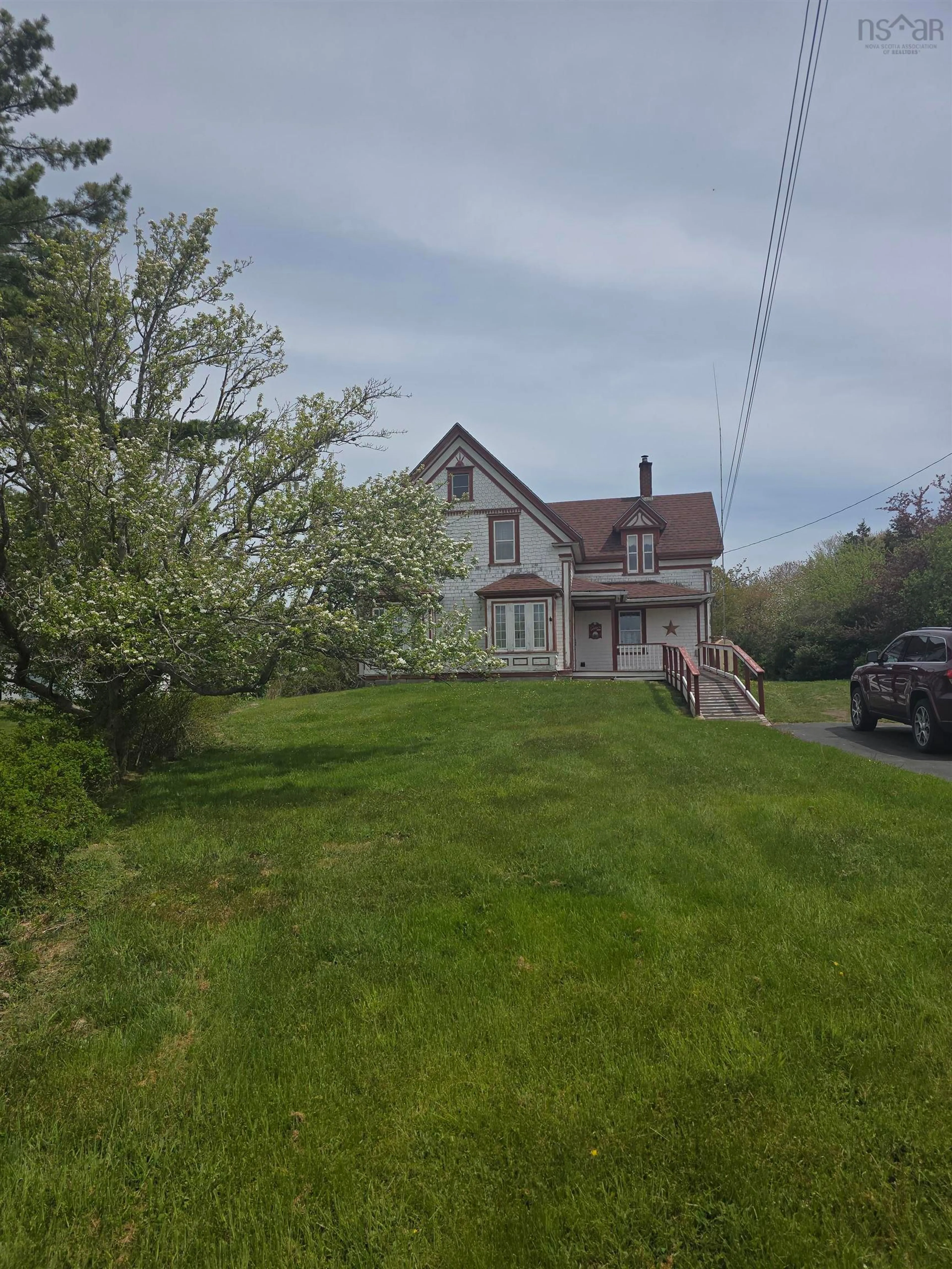 A pic from outside/outdoor area/front of a property/back of a property/a pic from drone, street for 2067 Sandy Point Rd, Sandy Point Nova Scotia B0T 1W0