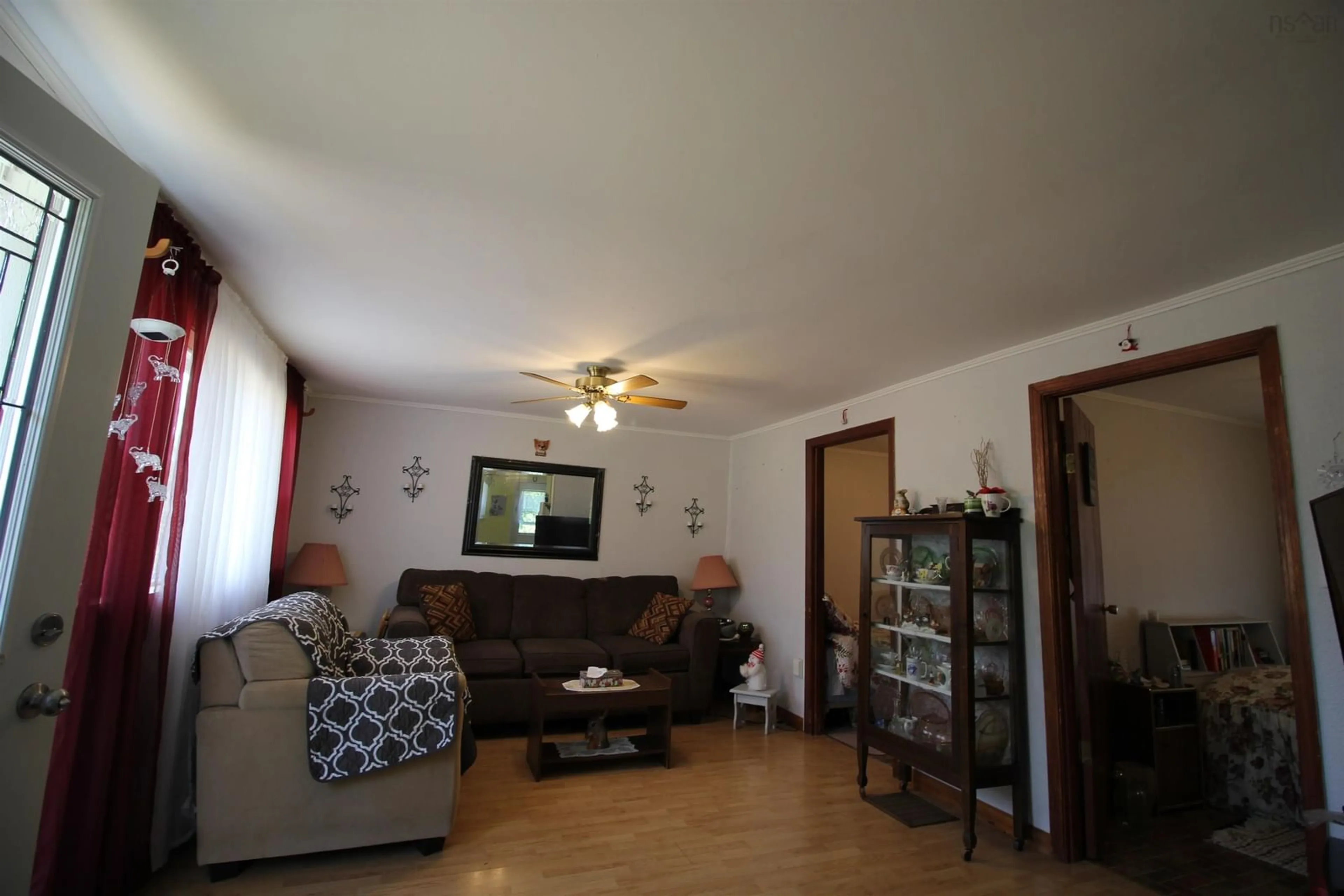 Living room with furniture, wood/laminate floor for 14621 Highway 1, Wilmot Nova Scotia B0P 1W0
