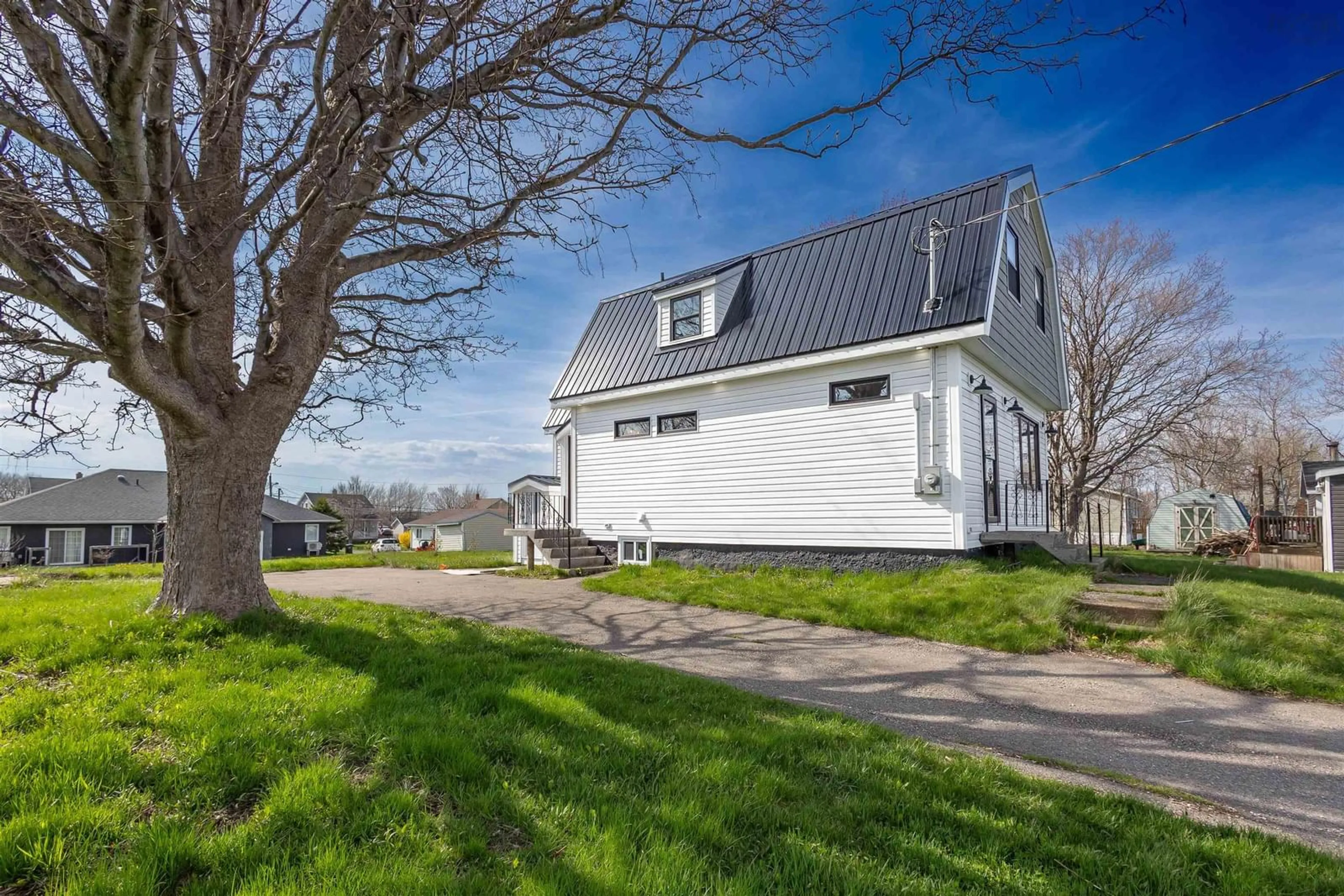 Home with vinyl exterior material, street for 49 Ocean Ave, Dominion Nova Scotia B1G 1J7