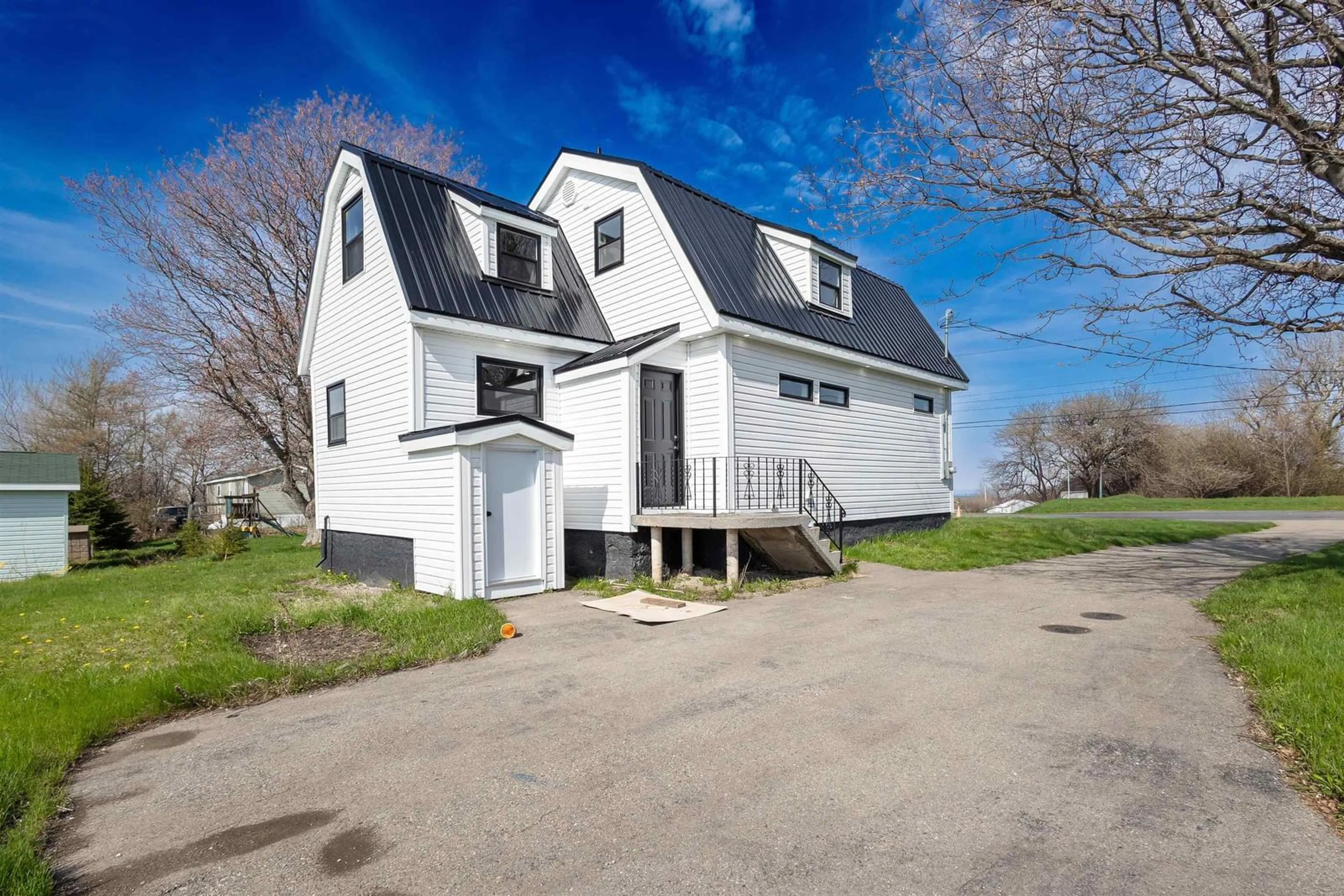 A pic from outside/outdoor area/front of a property/back of a property/a pic from drone, street for 49 Ocean Ave, Dominion Nova Scotia B1G 1J7