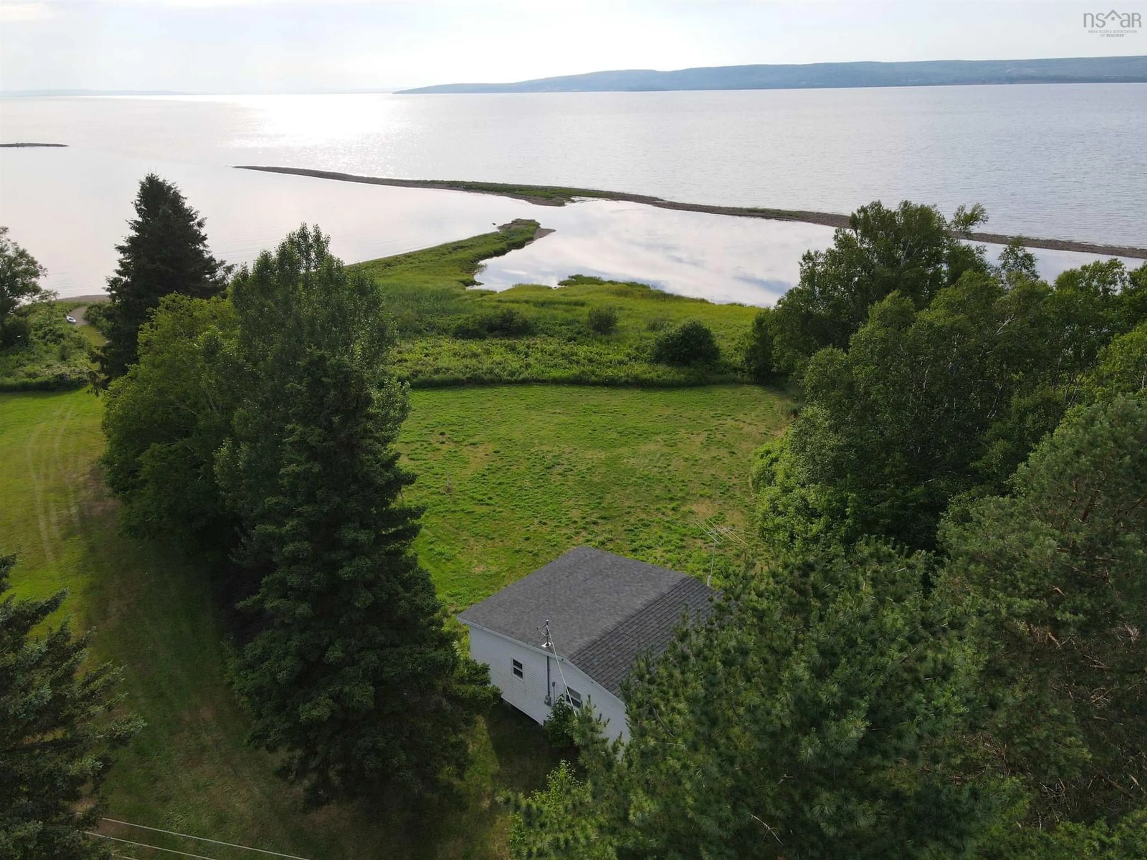 A pic from outside/outdoor area/front of a property/back of a property/a pic from drone, water/lake/river/ocean view for 8356 East Bay Hwy, Big Pond Nova Scotia B1J 1Z6