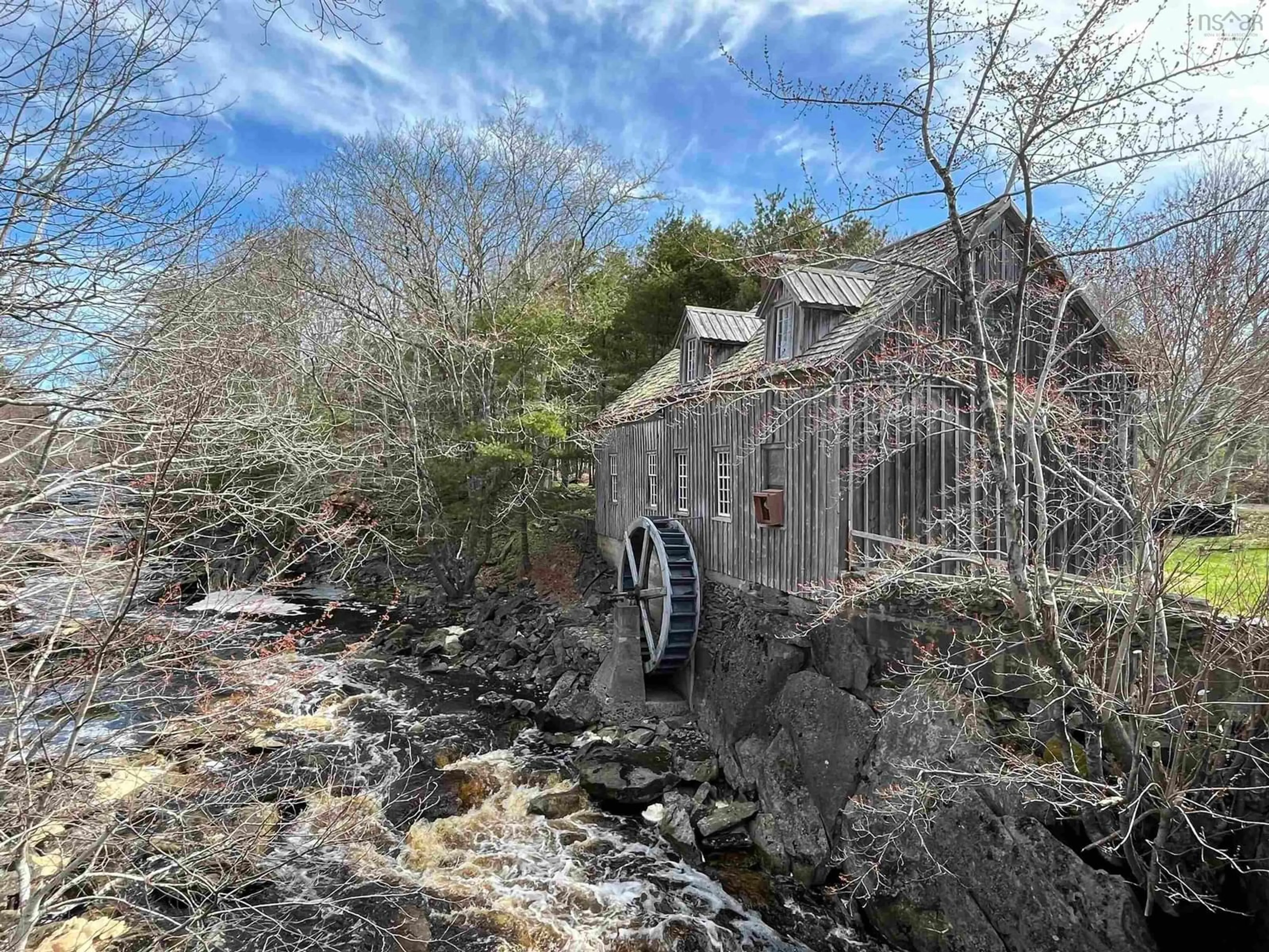 A pic from outside/outdoor area/front of a property/back of a property/a pic from drone, water/lake/river/ocean view for 1582 Highway 103, Sable River Nova Scotia B0T 1E0