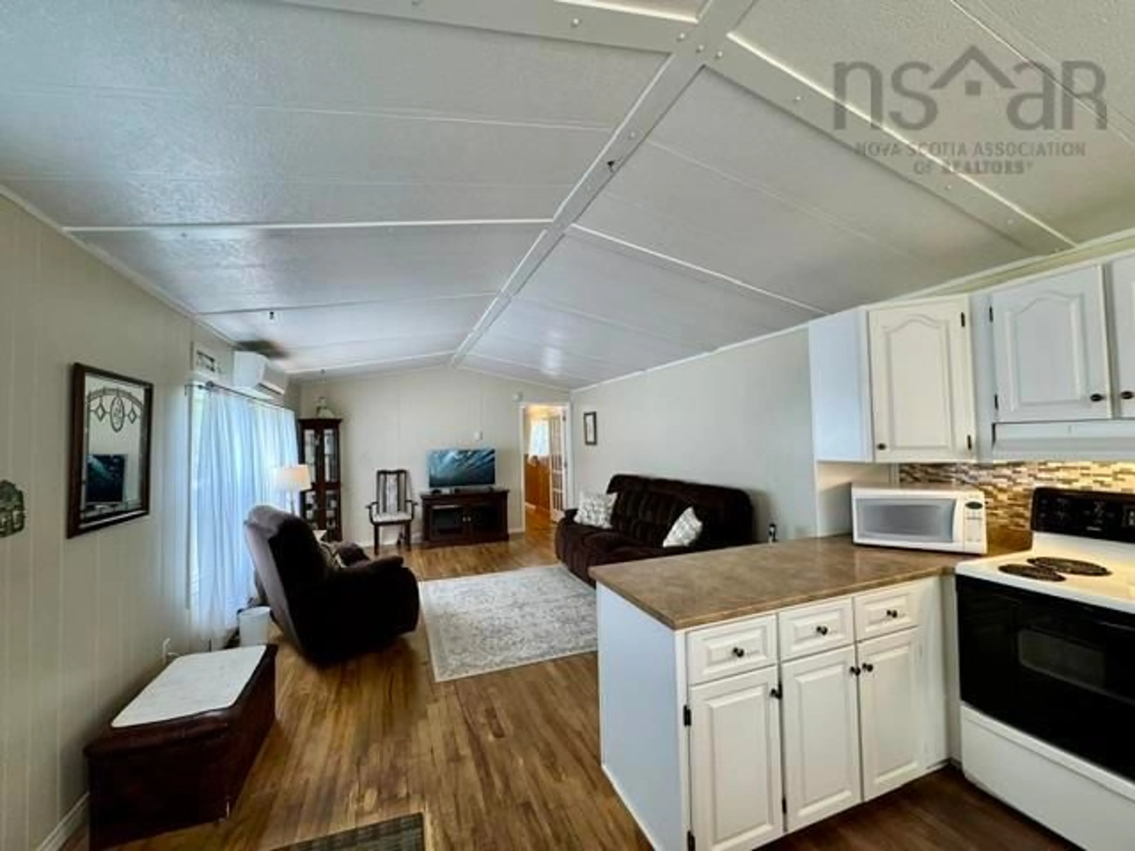 Open concept kitchen, wood/laminate floor for 491 Glenrise Dr, Beaver Bank Nova Scotia B4E 2M3