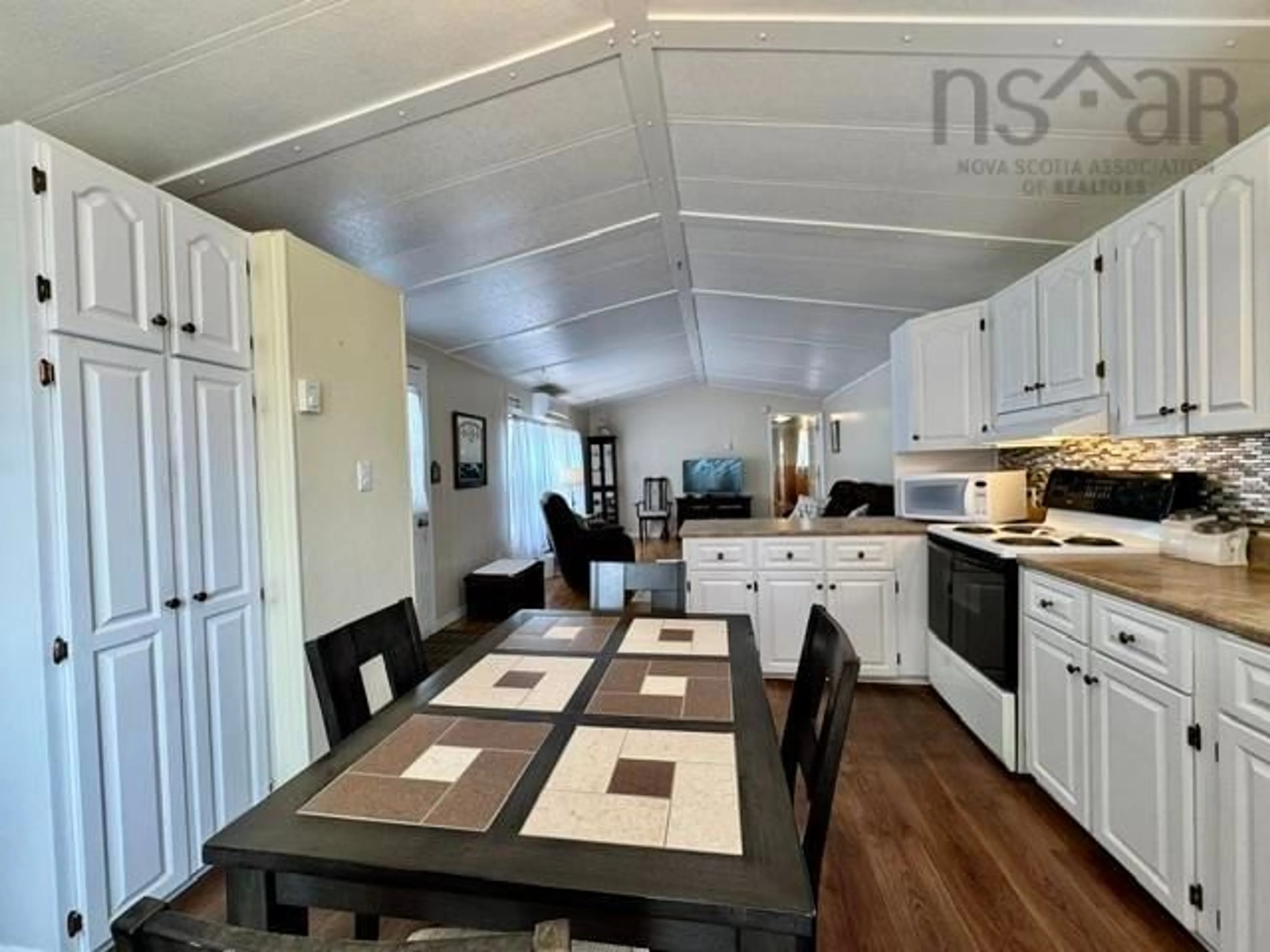 Open concept kitchen, wood/laminate floor for 491 Glenrise Dr, Beaver Bank Nova Scotia B4E 2M3