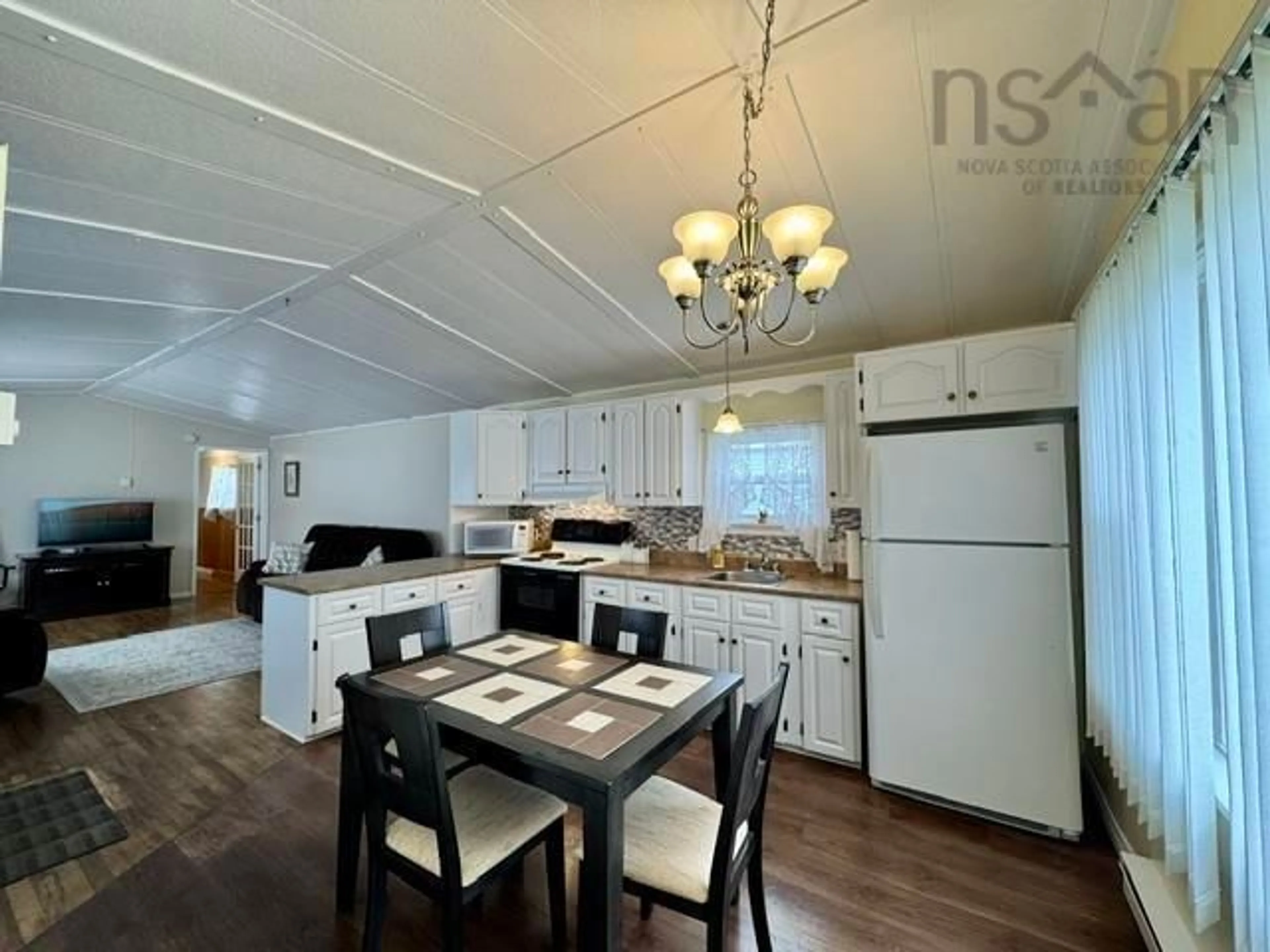 Open concept kitchen, wood/laminate floor for 491 Glenrise Dr, Beaver Bank Nova Scotia B4E 2M3