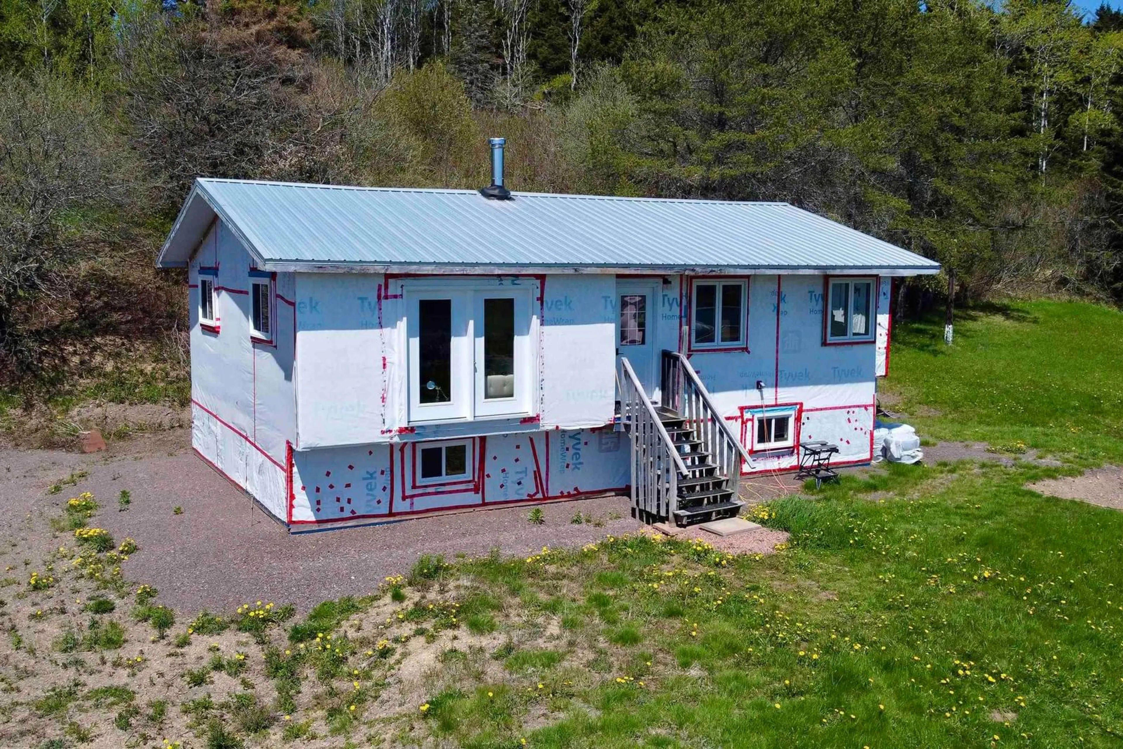 A pic from outside/outdoor area/front of a property/back of a property/a pic from drone, building for 61 Ballfield Rd, Diligent River Nova Scotia B0M 1S0