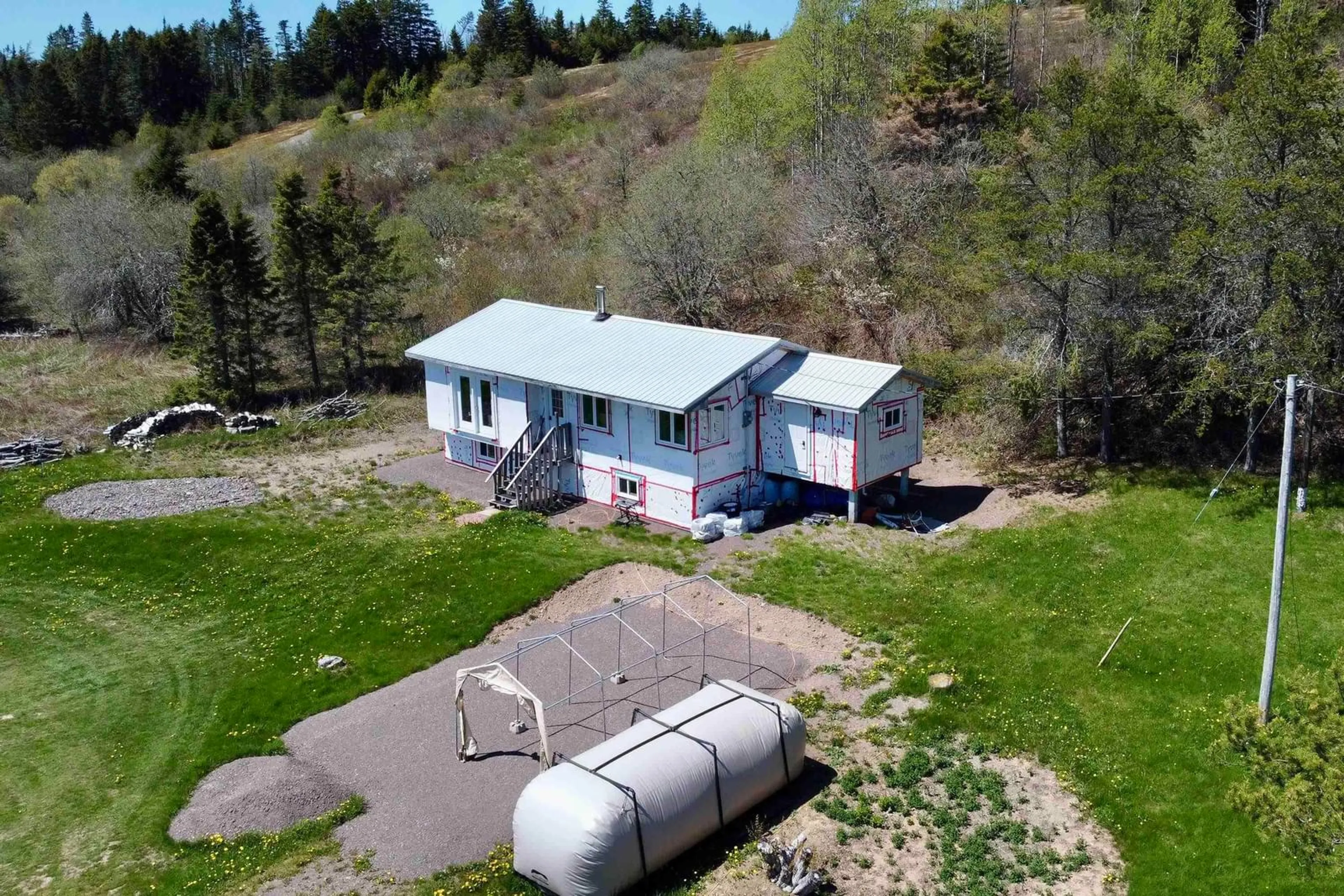 A pic from outside/outdoor area/front of a property/back of a property/a pic from drone, building for 61 Ballfield Rd, Diligent River Nova Scotia B0M 1S0
