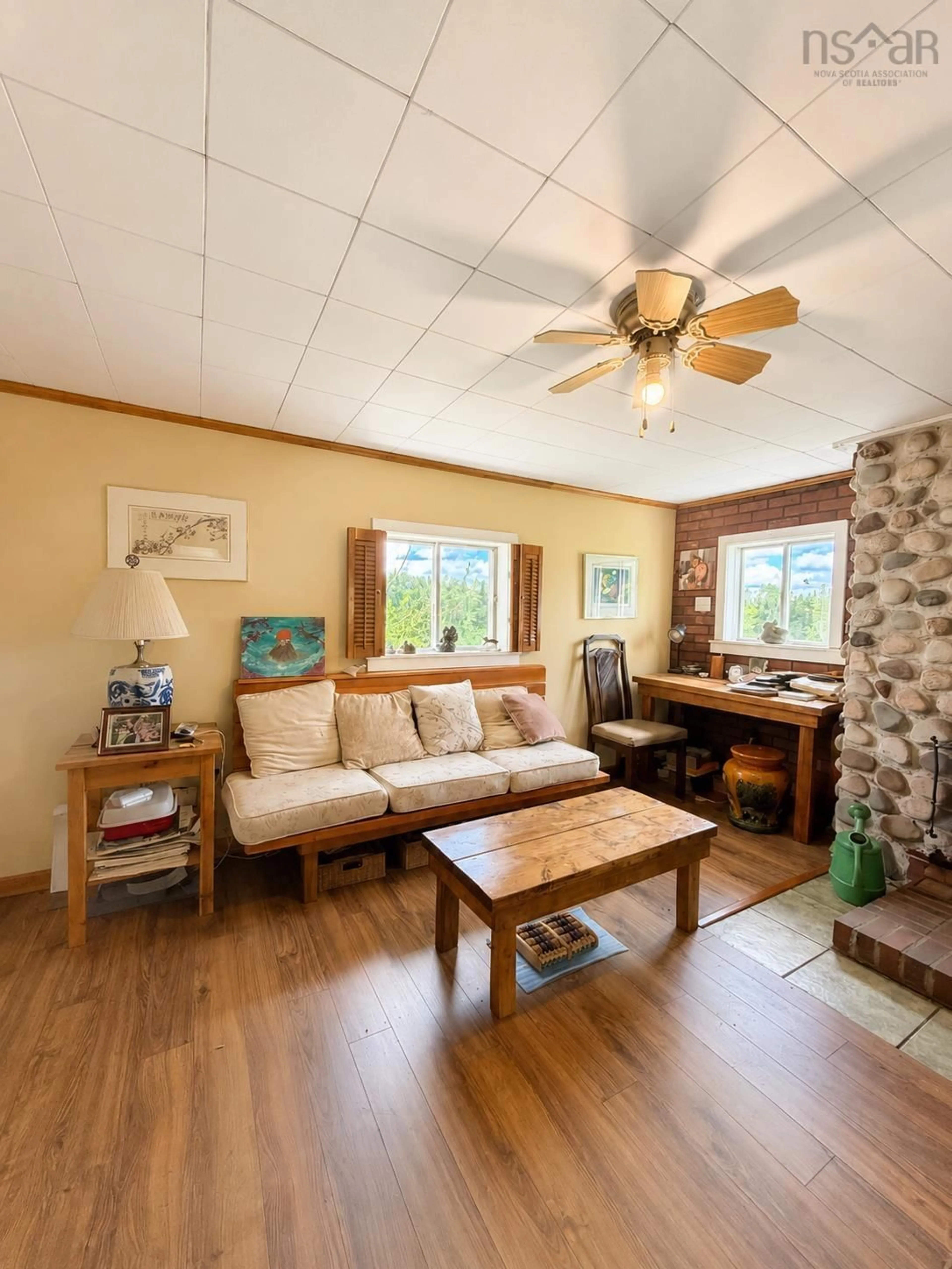 Living room with furniture, wood/laminate floor for 801 West River Station Rd, Watervale Nova Scotia B0K 1Z0