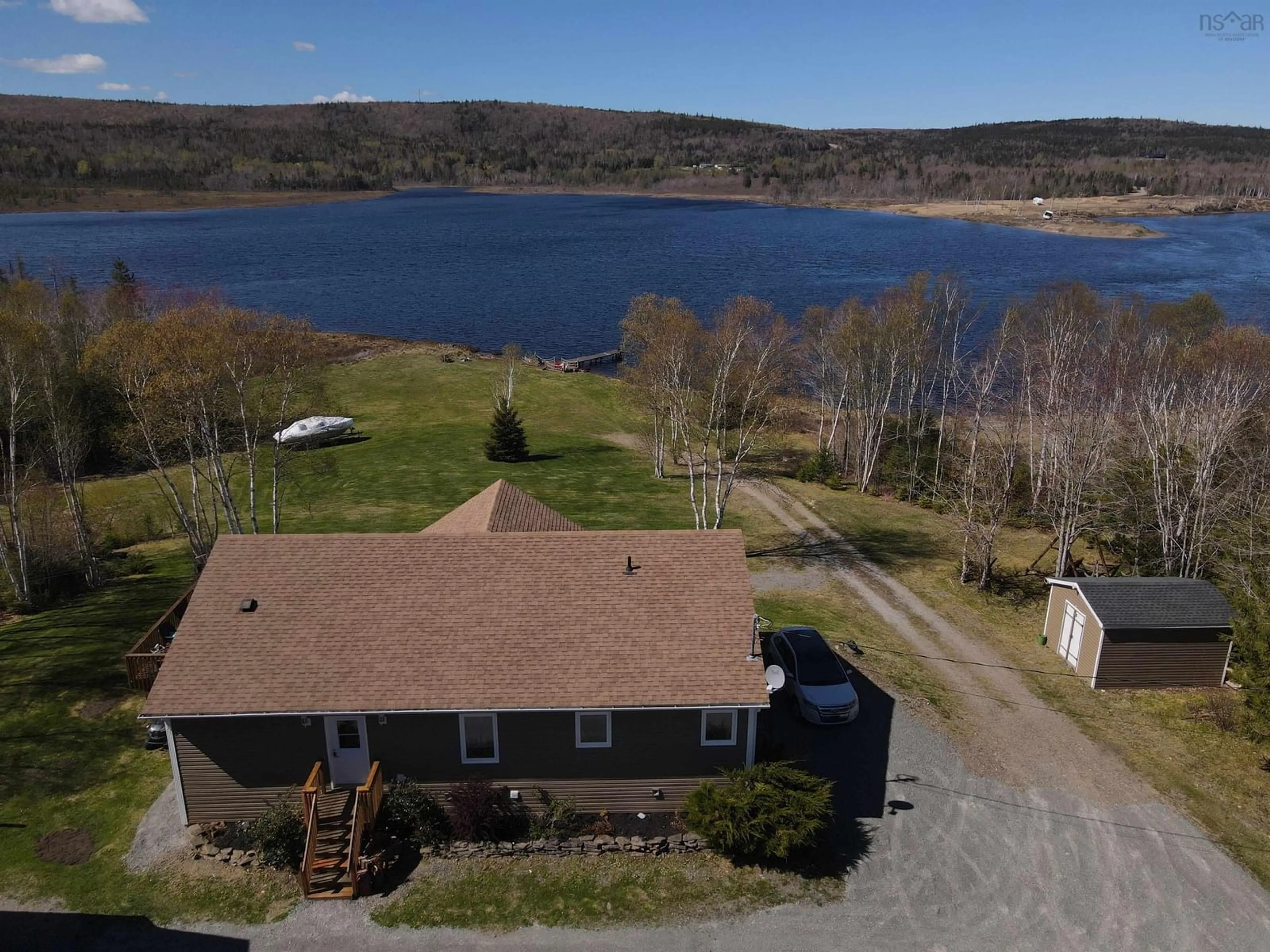 A pic from outside/outdoor area/front of a property/back of a property/a pic from drone, water/lake/river/ocean view for 448 Grand Mira South Rd Rd, Juniper Mountain Nova Scotia B1K 1G2