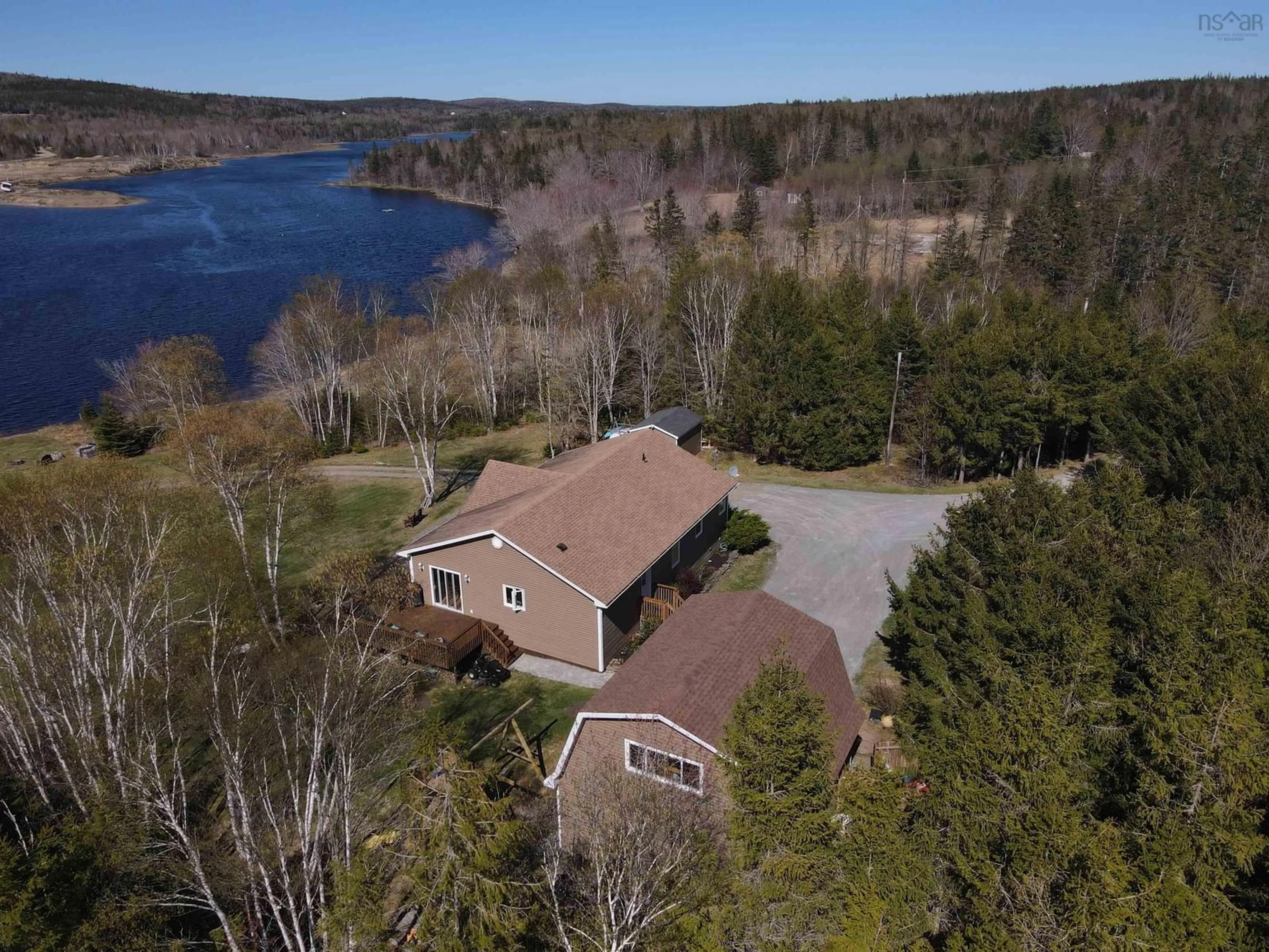 A pic from outside/outdoor area/front of a property/back of a property/a pic from drone, water/lake/river/ocean view for 448 Grand Mira South Rd Rd, Juniper Mountain Nova Scotia B1K 1G2