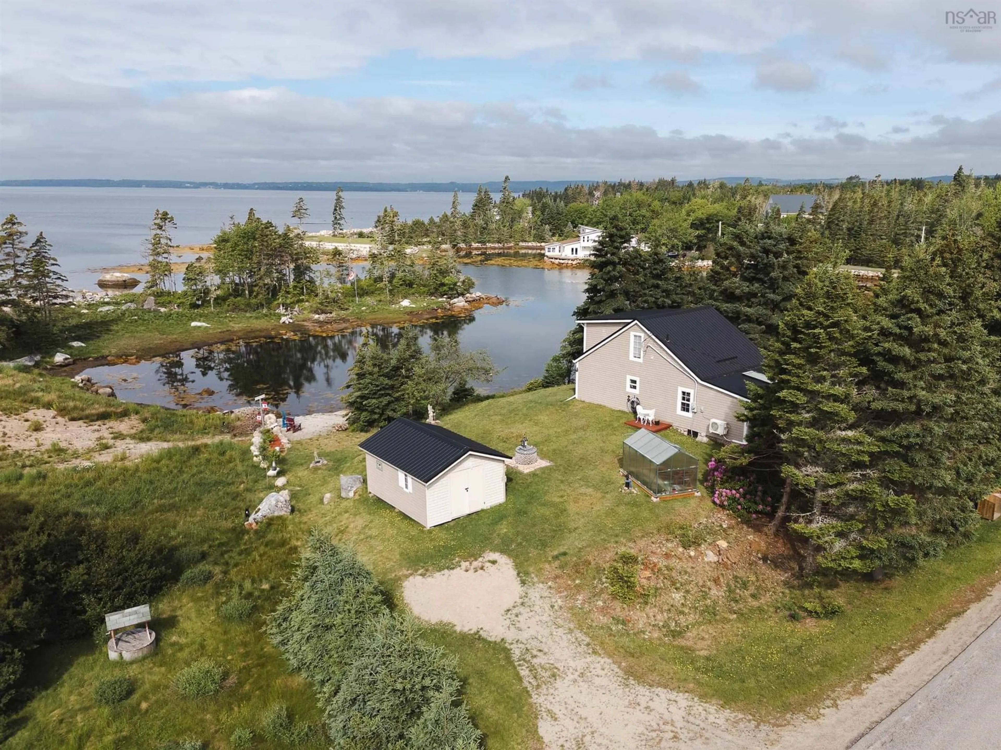 A pic from outside/outdoor area/front of a property/back of a property/a pic from drone, water/lake/river/ocean view for 7187 Highway 329 Hwy, East River Nova Scotia B0J 1T0