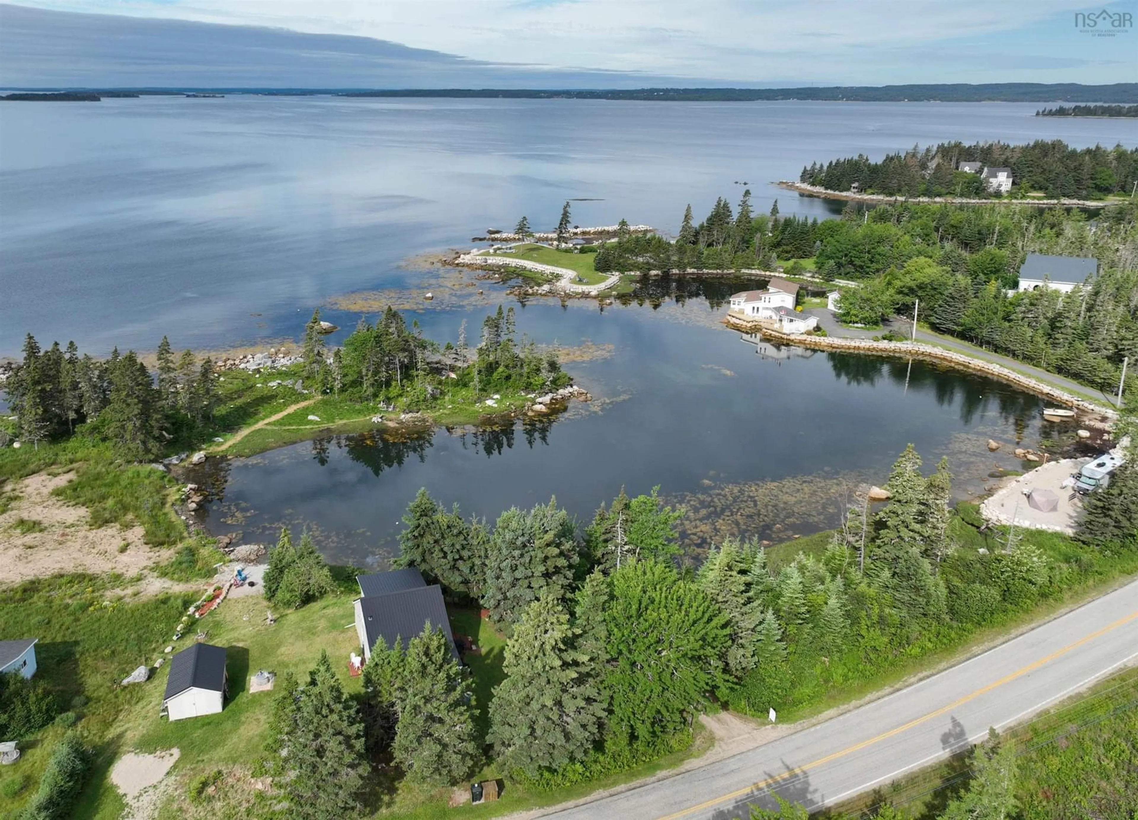 A pic from outside/outdoor area/front of a property/back of a property/a pic from drone, water/lake/river/ocean view for 7187 Highway 329 Hwy, East River Nova Scotia B0J 1T0
