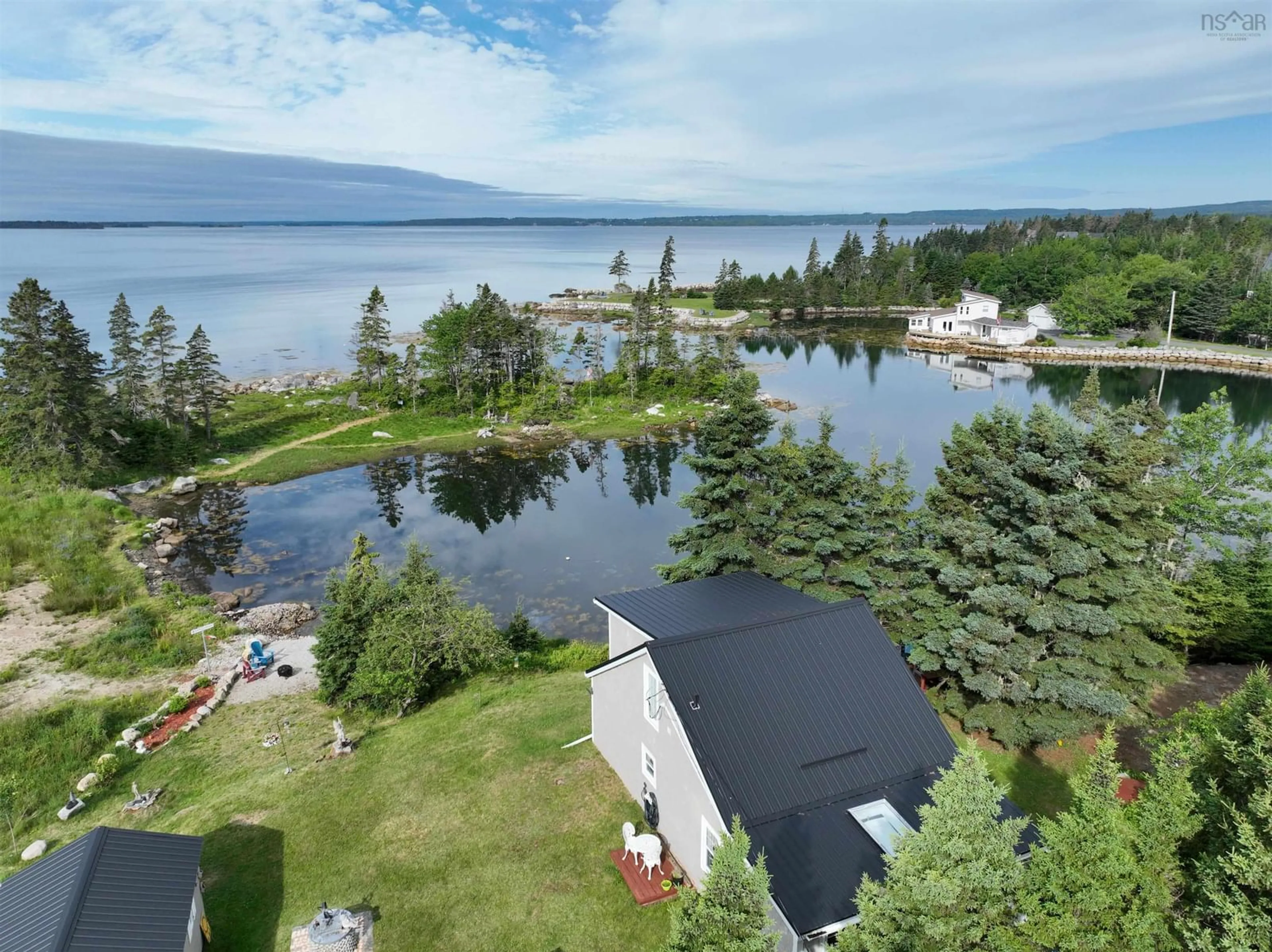 A pic from outside/outdoor area/front of a property/back of a property/a pic from drone, water/lake/river/ocean view for 7187 Highway 329 Hwy, East River Nova Scotia B0J 1T0