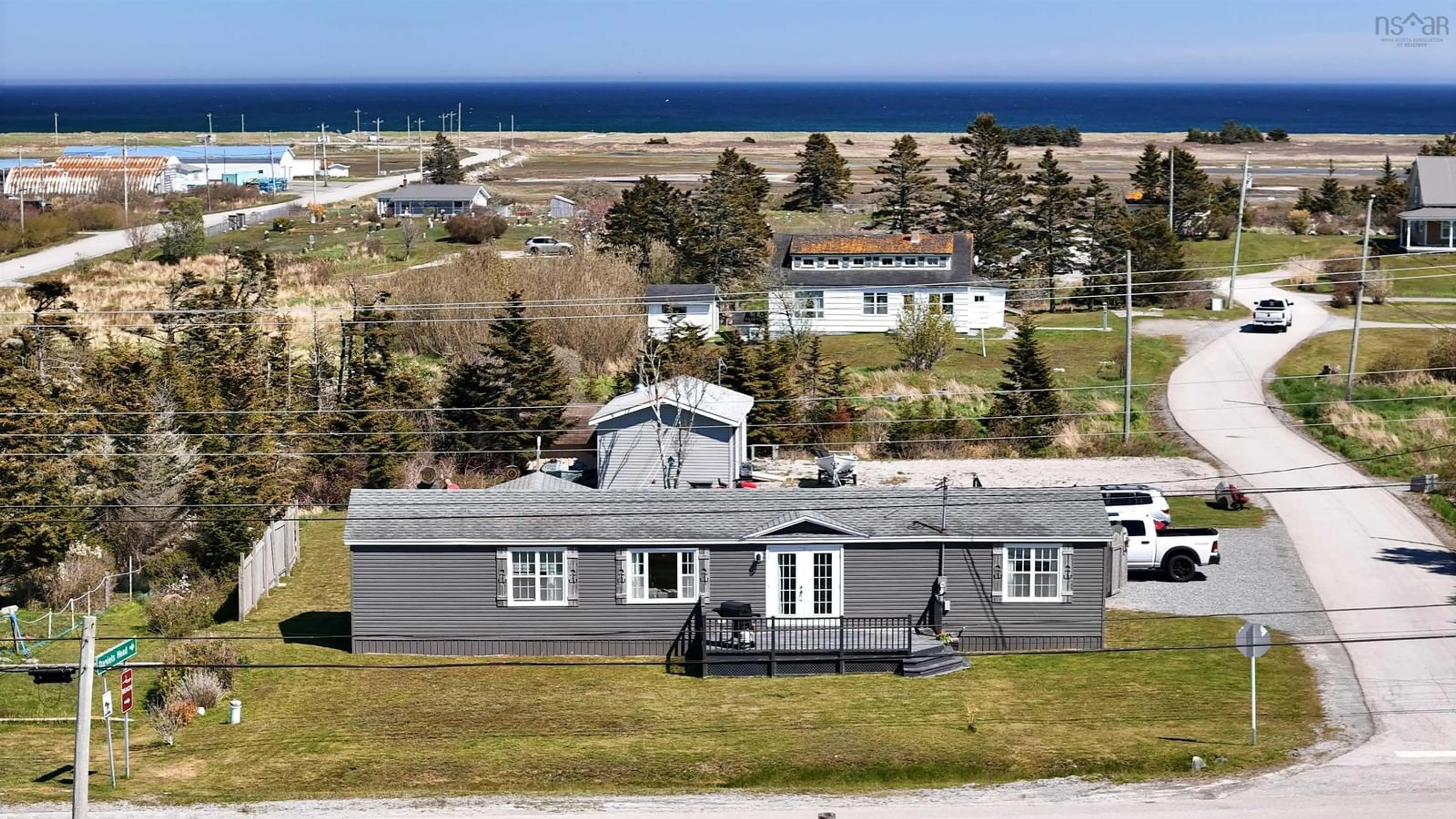 A pic from outside/outdoor area/front of a property/back of a property/a pic from drone, unknown for 5 Nickerson Rd, South Side Nova Scotia B0W 1P0