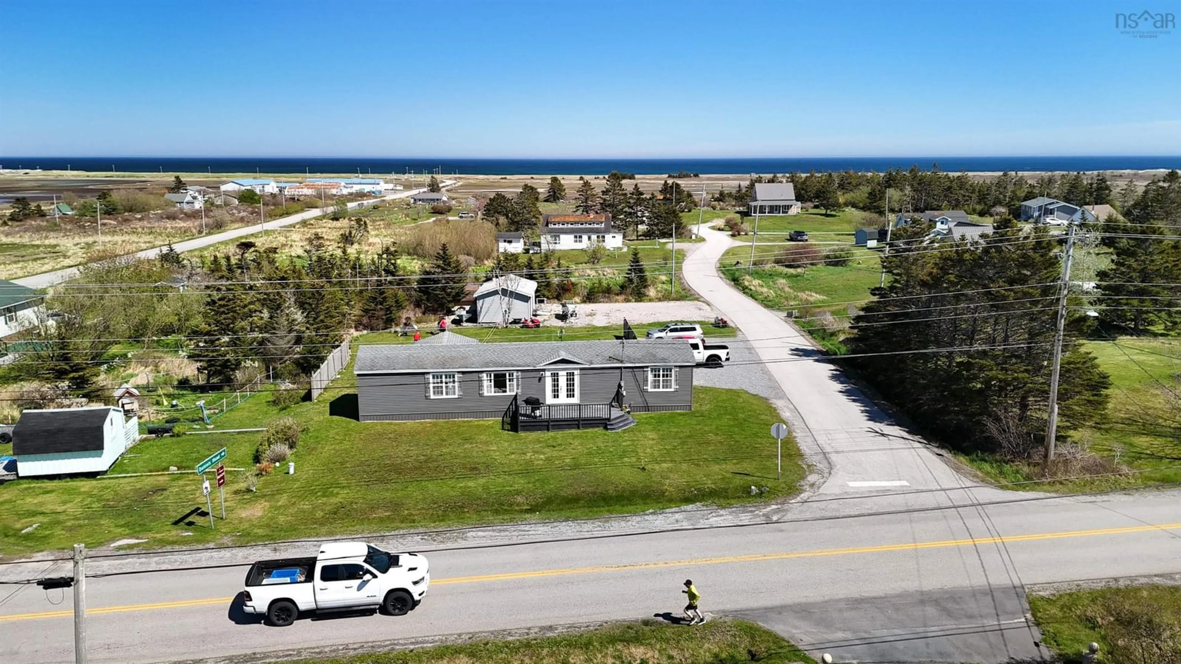 A pic from outside/outdoor area/front of a property/back of a property/a pic from drone, unknown for 5 Nickerson Rd, South Side Nova Scotia B0W 1P0
