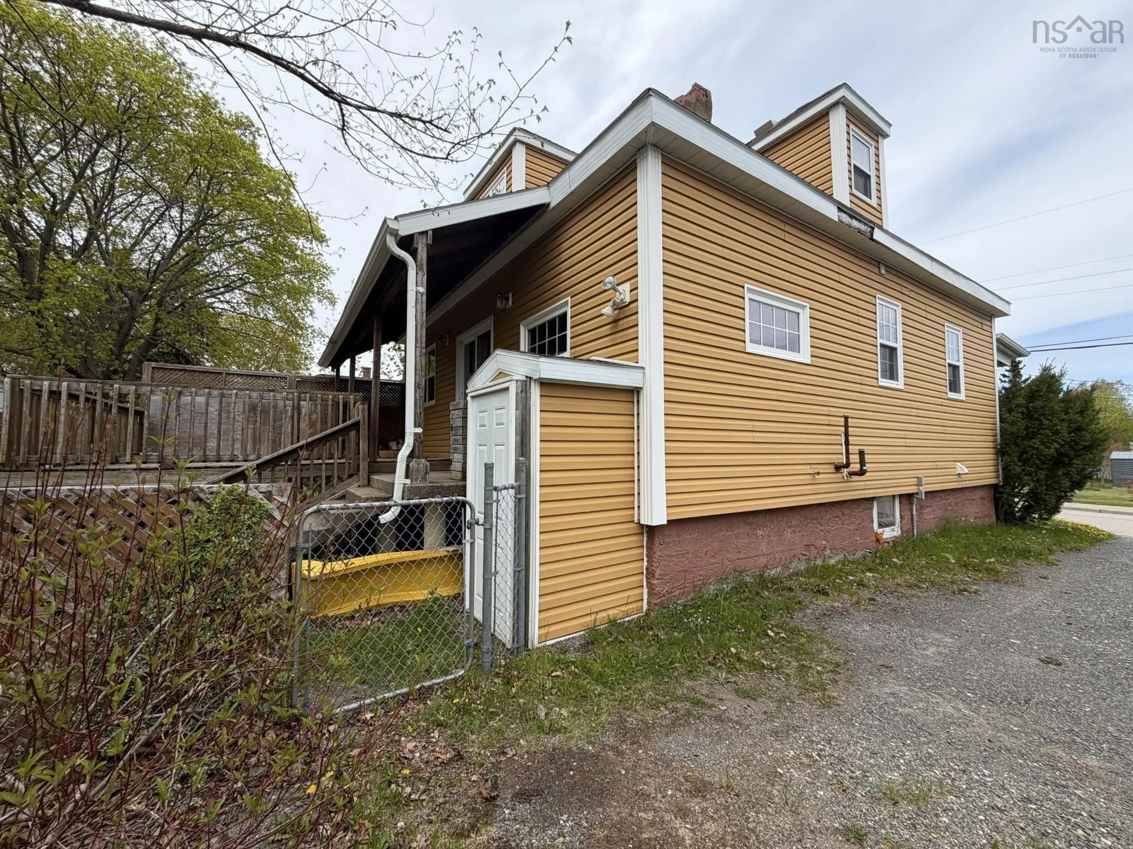 A pic from outside/outdoor area/front of a property/back of a property/a pic from drone, street for 128 Brook St, North Sydney Nova Scotia B2A 2K4