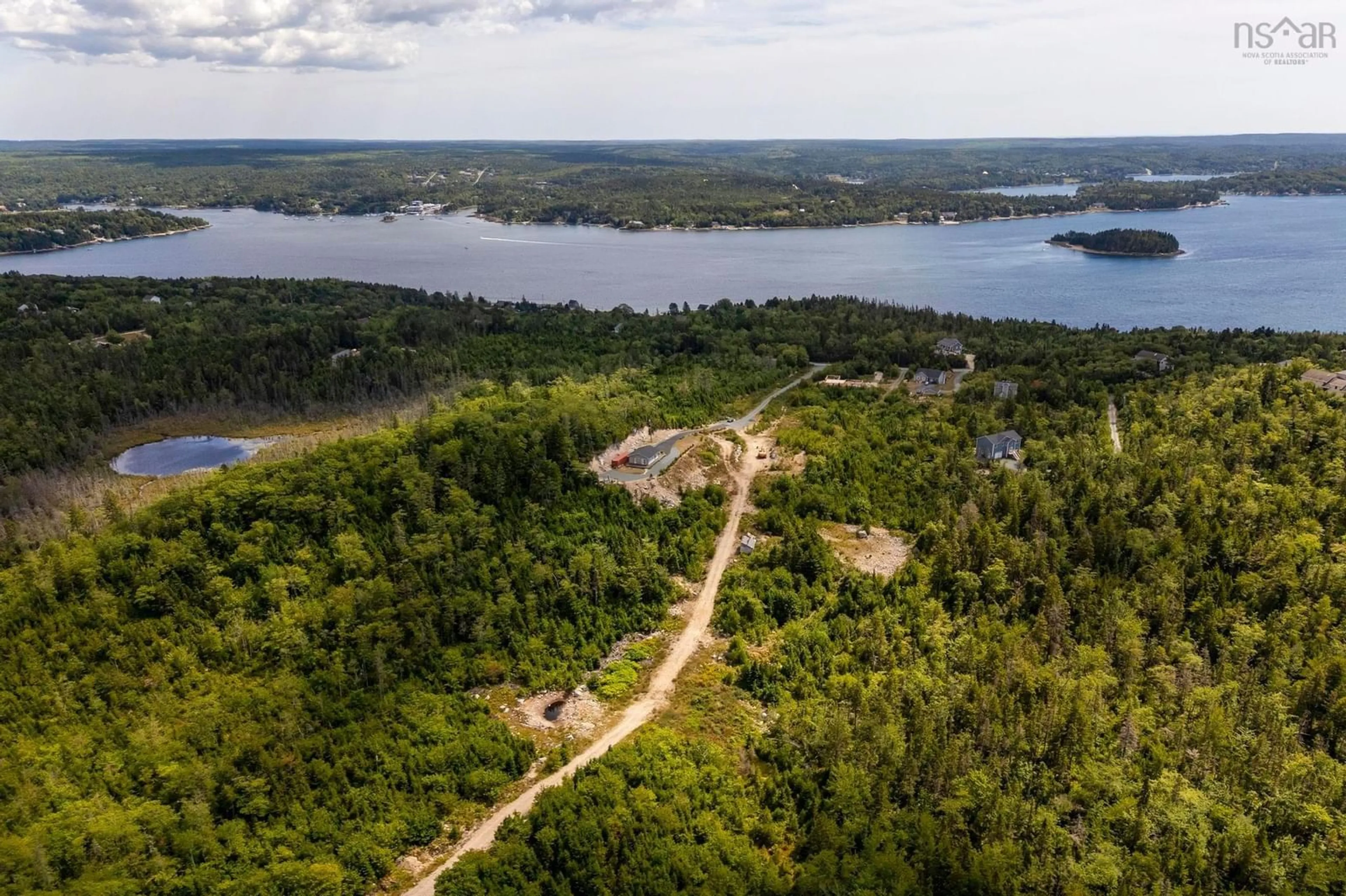 A pic from outside/outdoor area/front of a property/back of a property/a pic from drone, water/lake/river/ocean view for 166 Hillside Dr, Boutiliers Point Nova Scotia B3Z 1W8
