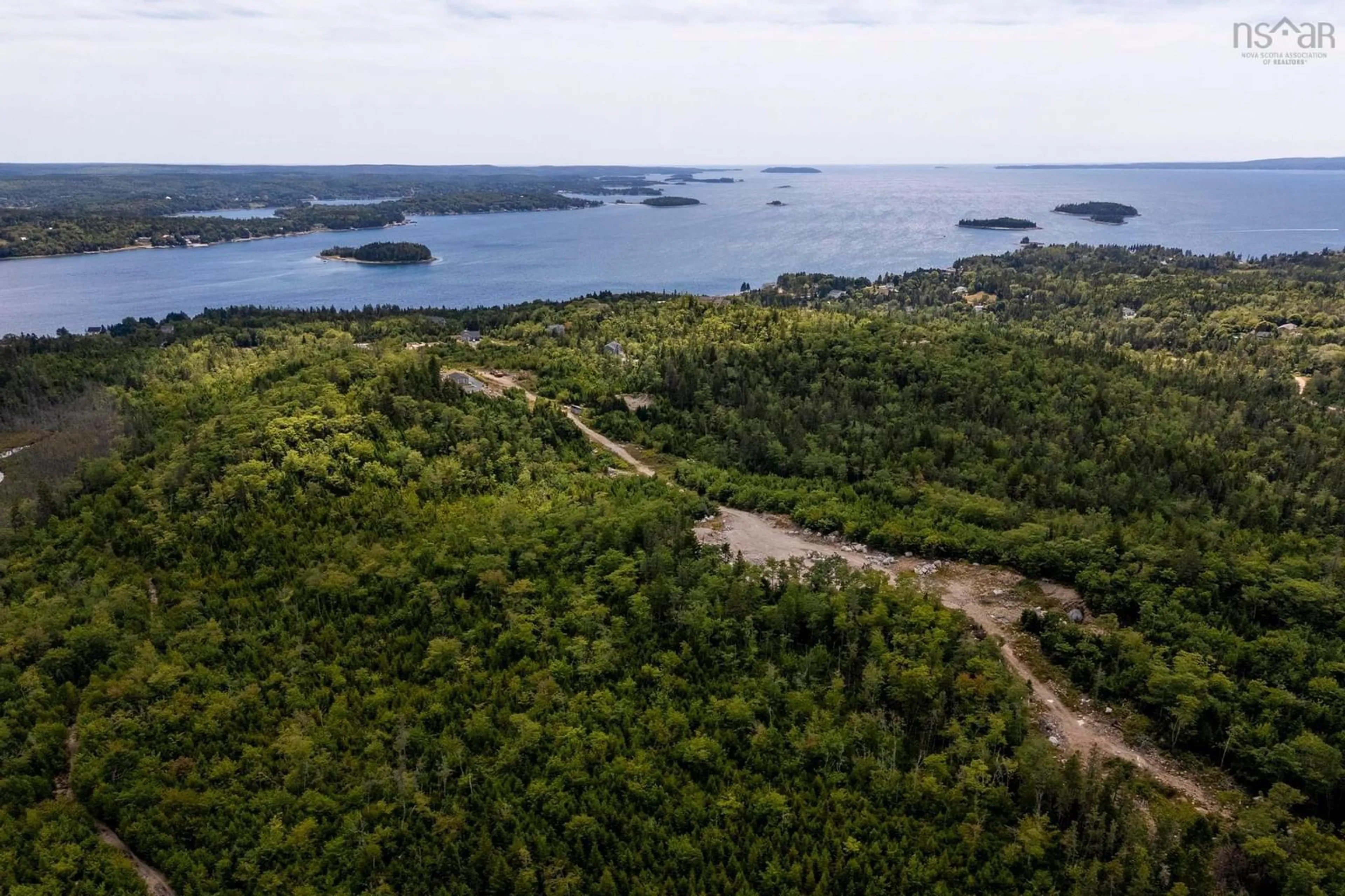 A pic from outside/outdoor area/front of a property/back of a property/a pic from drone, water/lake/river/ocean view for 166 Hillside Dr, Boutiliers Point Nova Scotia B3Z 1W8