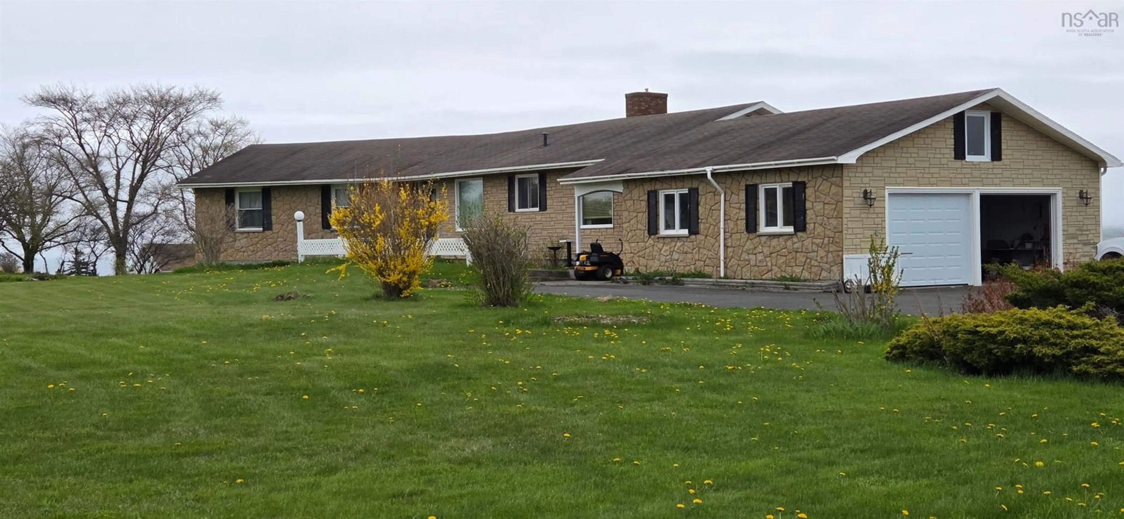 A pic from outside/outdoor area/front of a property/back of a property/a pic from drone, unknown for 837 Shore Rd, Sydney Mines Nova Scotia B1V 1A7