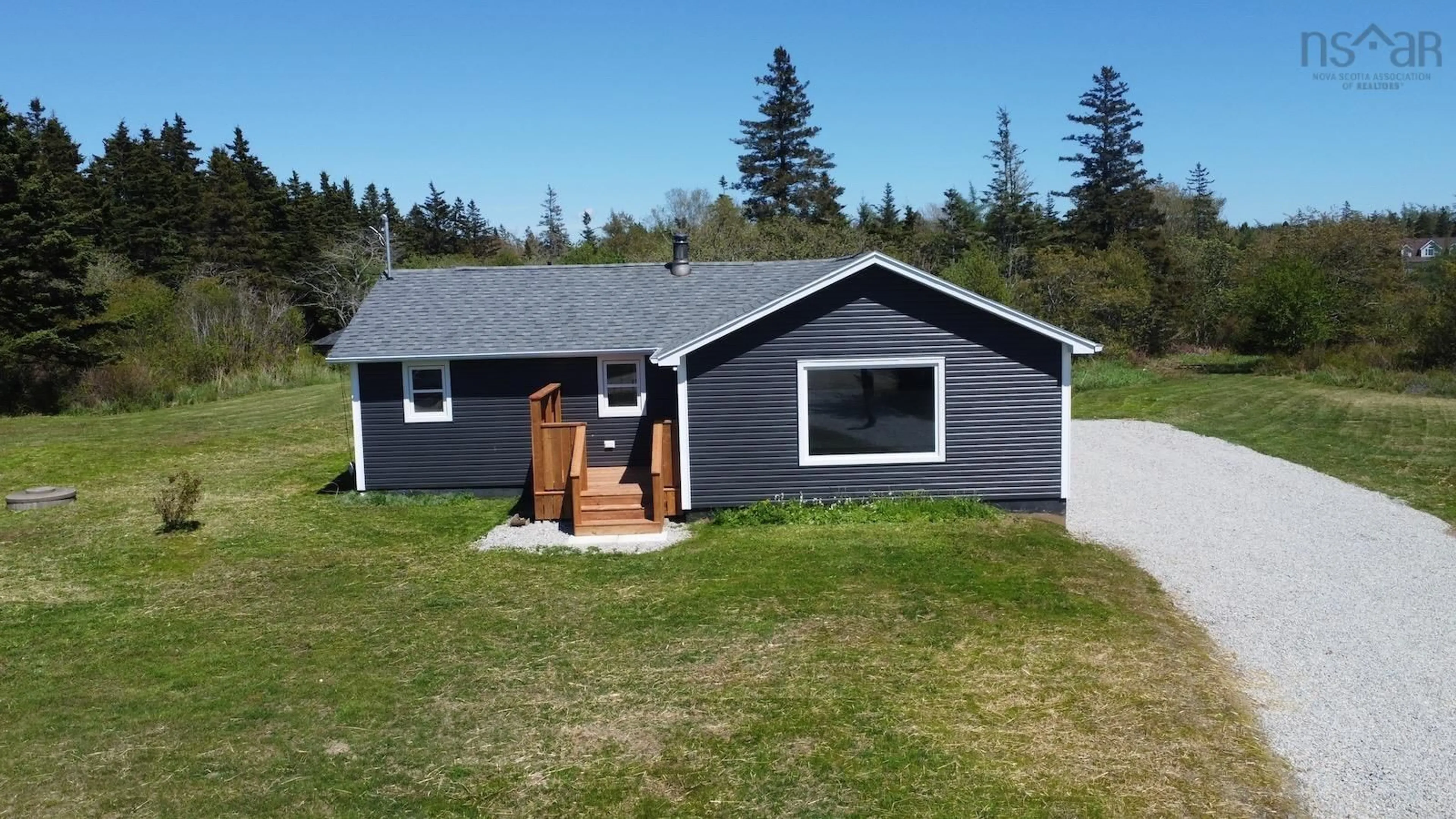 Home with vinyl exterior material, street for 22 Hardwood Hills Rd, Little River Harbour Nova Scotia B0W 1B0