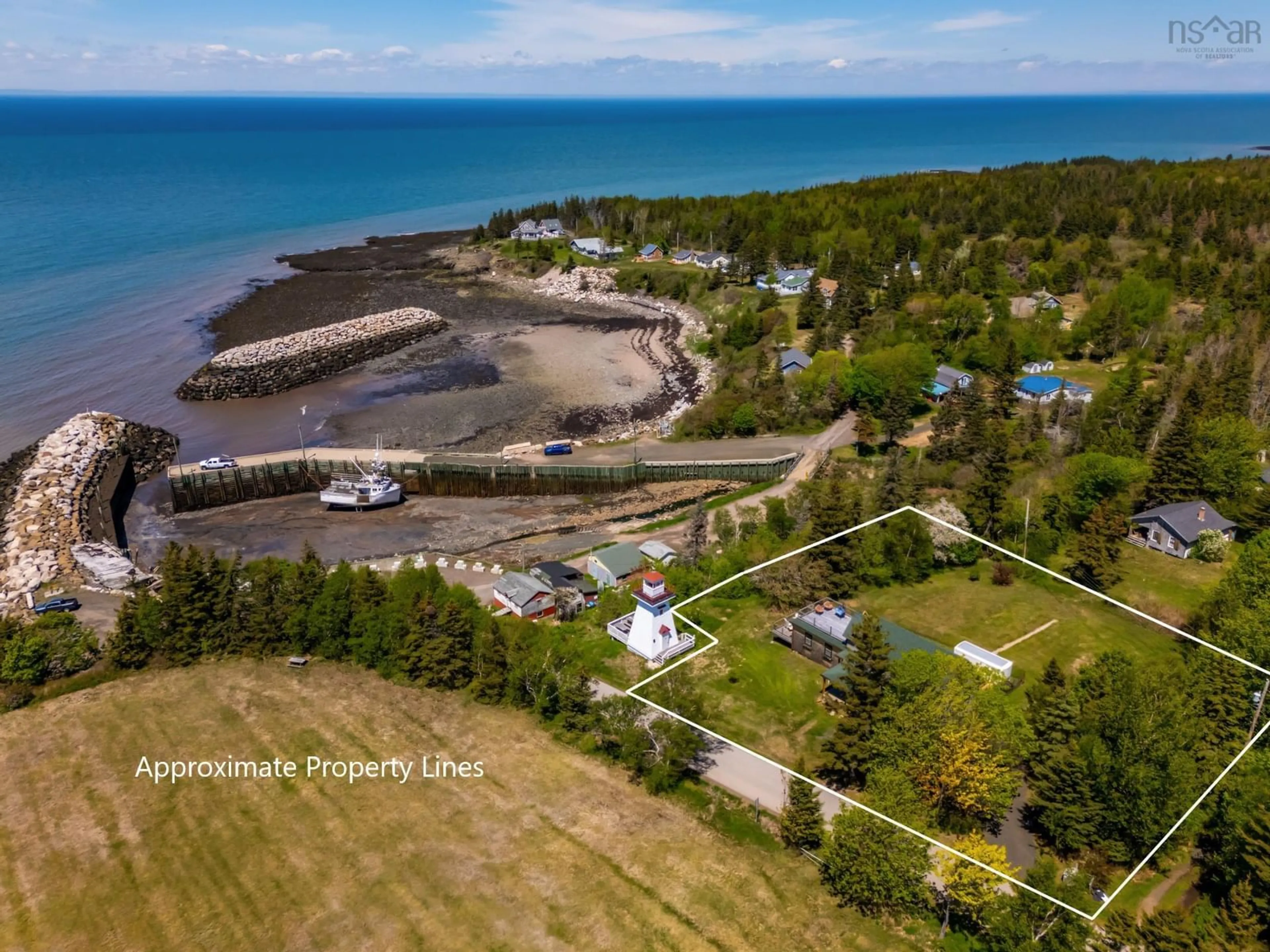 A pic from outside/outdoor area/front of a property/back of a property/a pic from drone, water/lake/river/ocean view for 62 Hampton Wharf Rd, Hampton Nova Scotia B0S 1L0