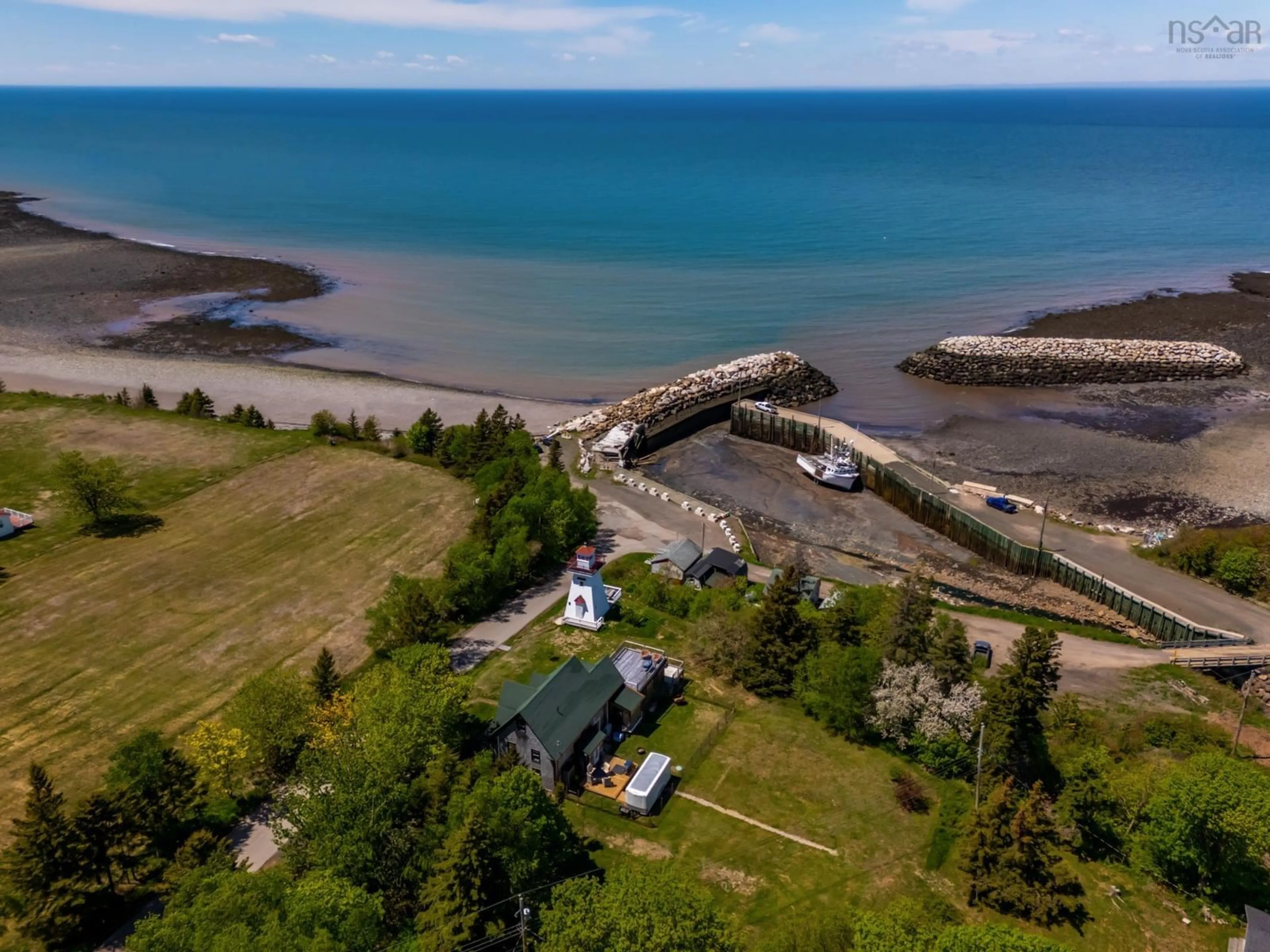 A pic from outside/outdoor area/front of a property/back of a property/a pic from drone, water/lake/river/ocean view for 62 Hampton Wharf Rd, Hampton Nova Scotia B0S 1L0