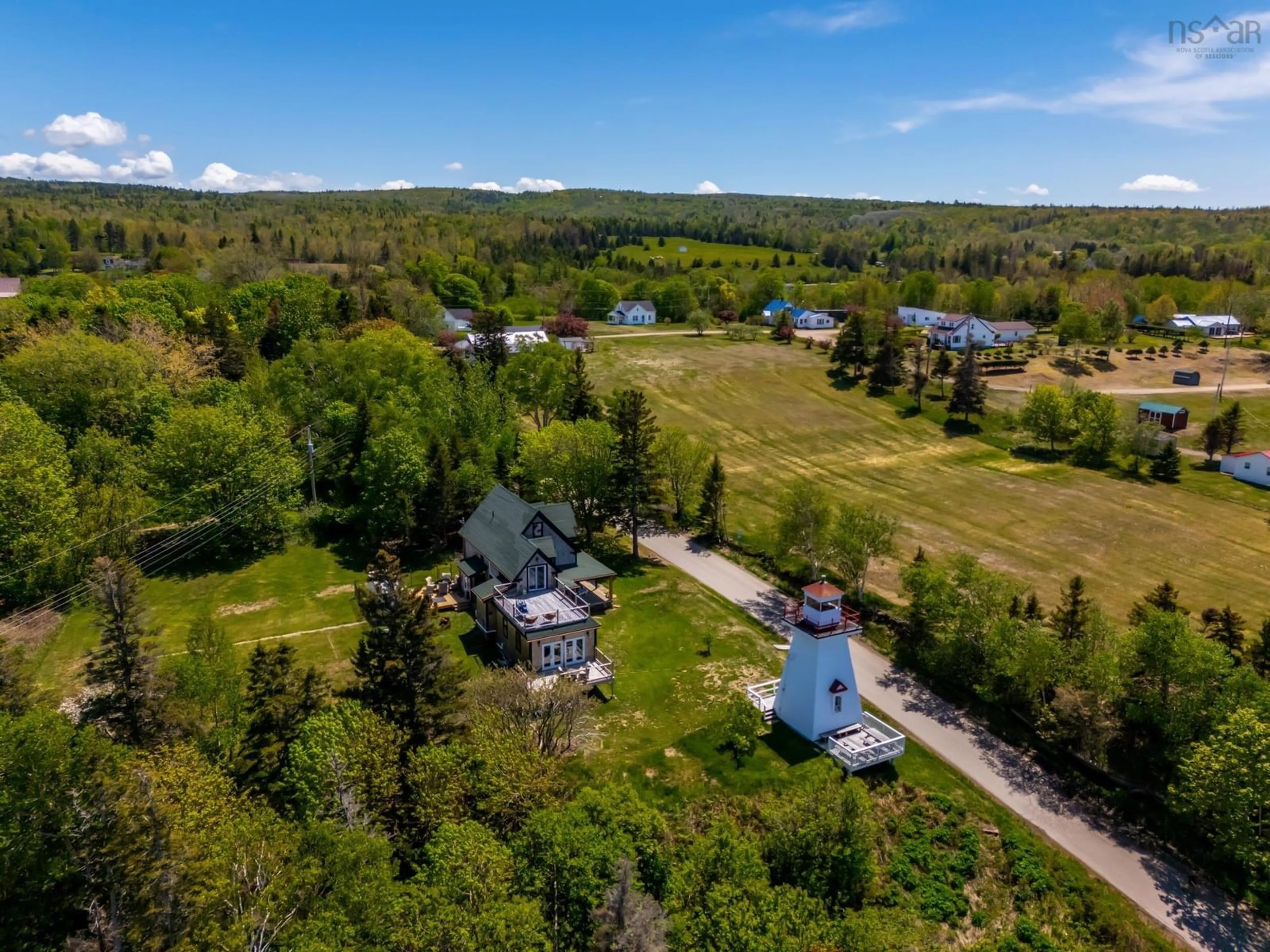 A pic from outside/outdoor area/front of a property/back of a property/a pic from drone, water/lake/river/ocean view for 62 Hampton Wharf Rd, Hampton Nova Scotia B0S 1L0