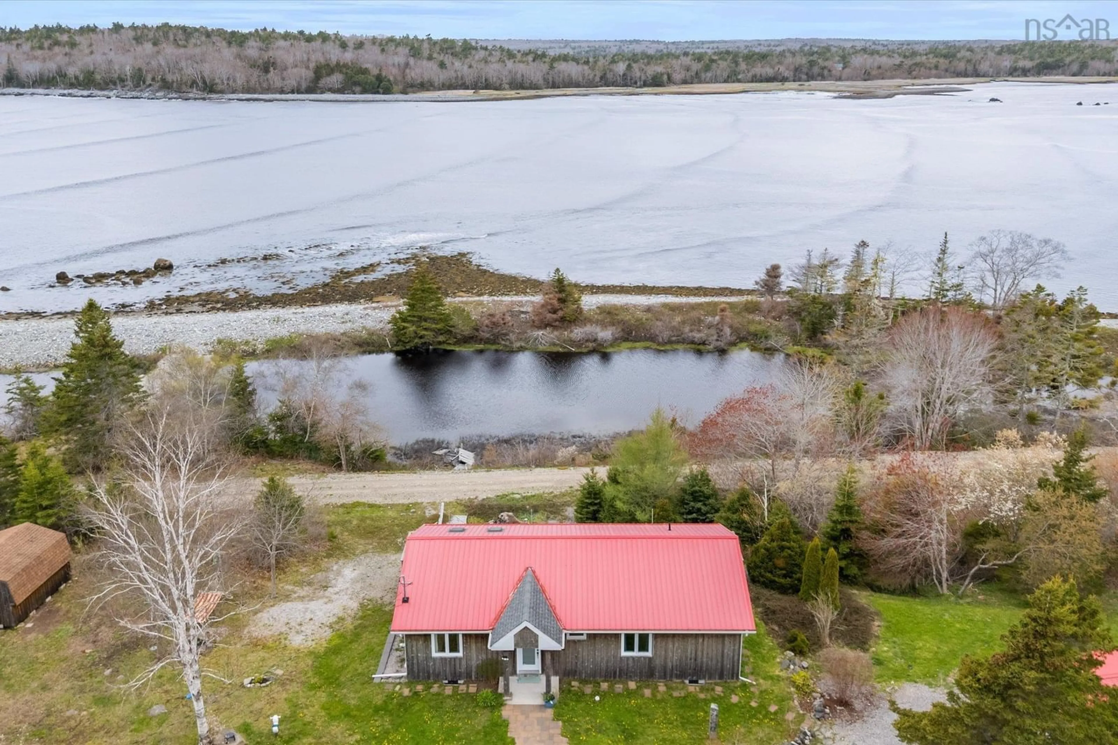 A pic from outside/outdoor area/front of a property/back of a property/a pic from drone, water/lake/river/ocean view for 5853 3 Hwy, East Jordan Nova Scotia B0T 1J0