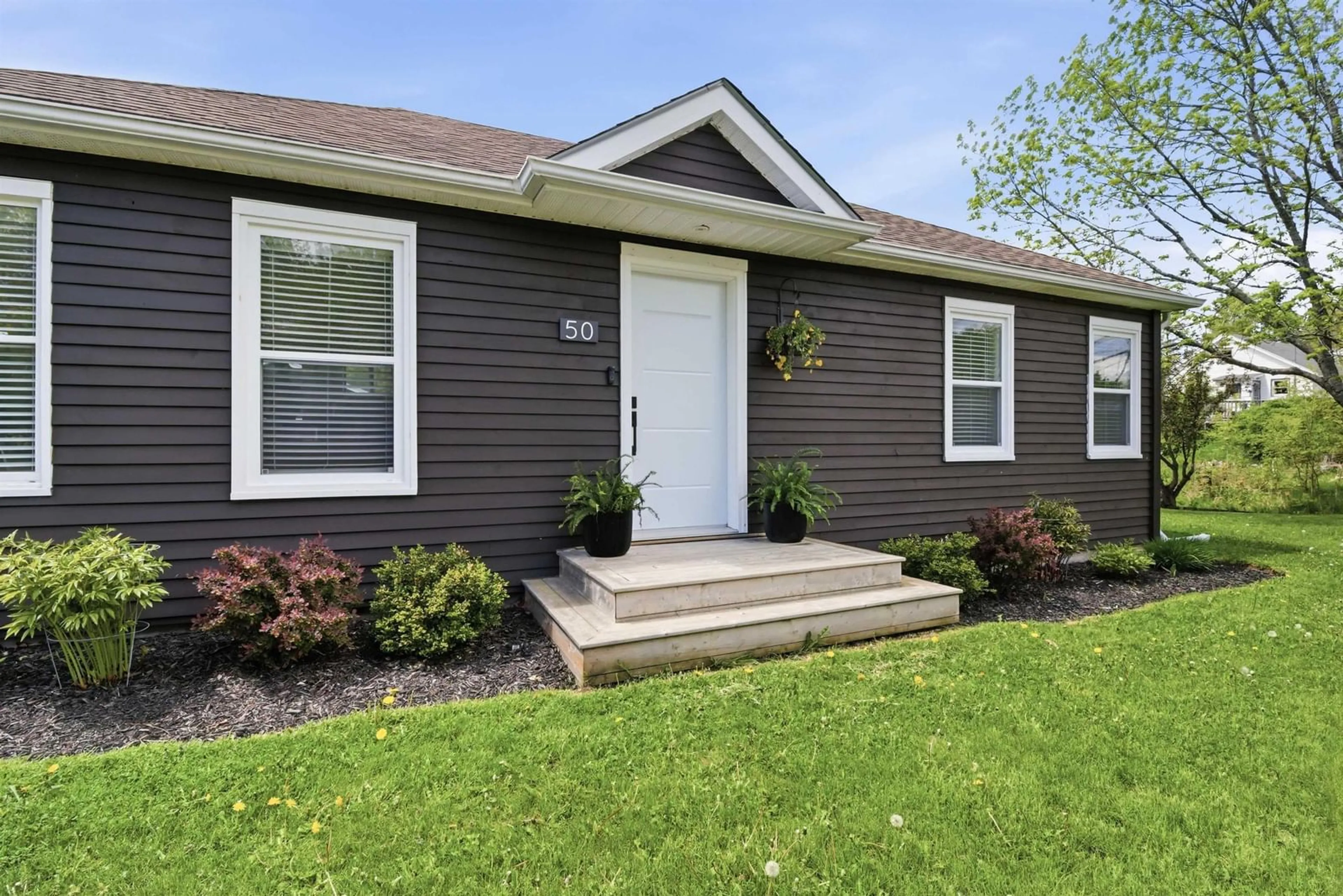 Home with vinyl exterior material, street for 50 Green Lane, Falmouth Nova Scotia B0P 1L0