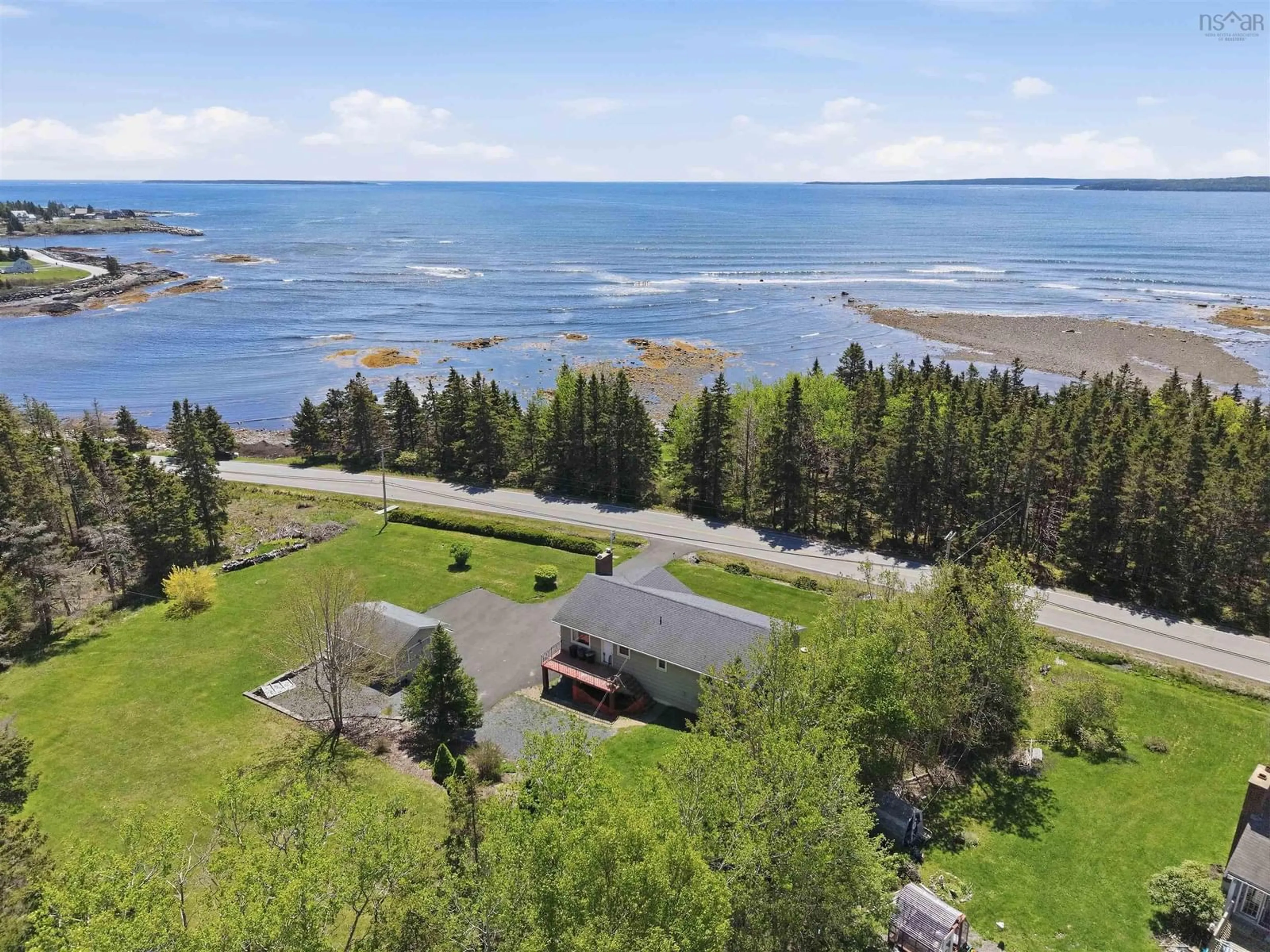 A pic from outside/outdoor area/front of a property/back of a property/a pic from drone, water/lake/river/ocean view for 1157 Blue Rocks Rd, Blue Rocks Nova Scotia B0J 2C0