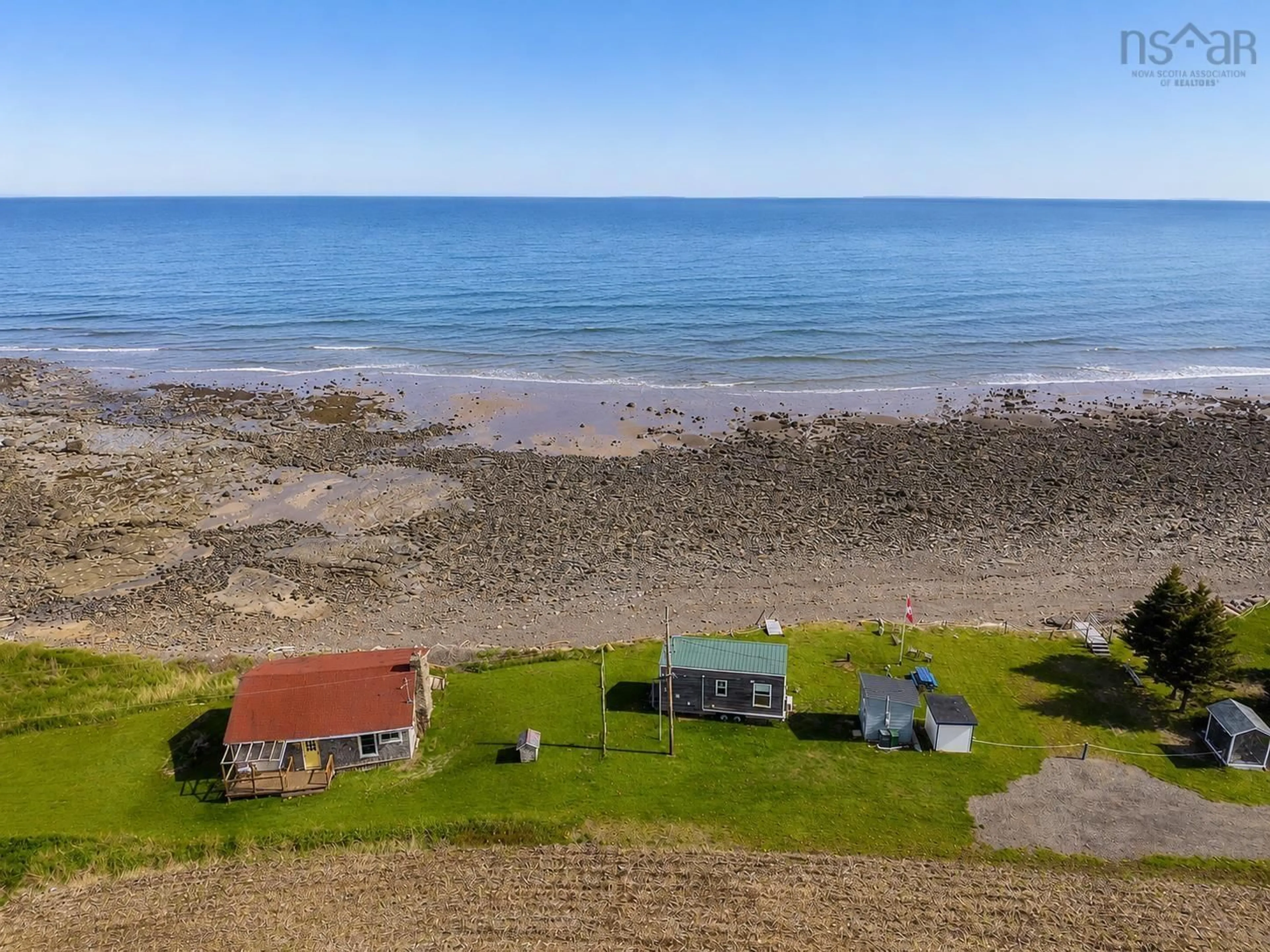 A pic from outside/outdoor area/front of a property/back of a property/a pic from drone, water/lake/river/ocean view for 113 Old Munroe Rd, Scots Bay Nova Scotia B0P 1H0