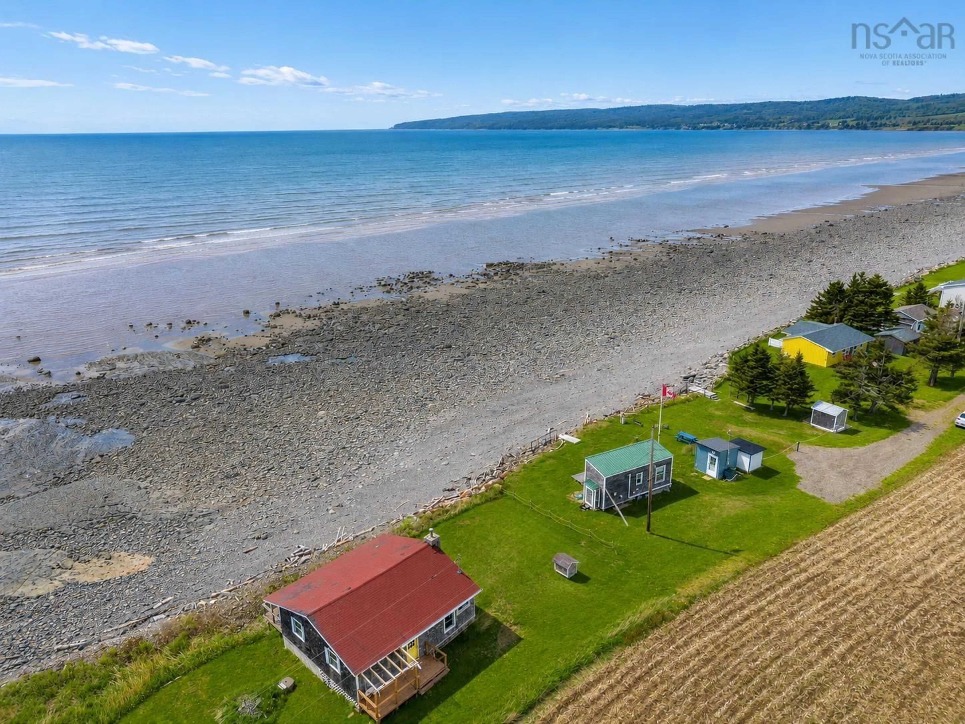 A pic from outside/outdoor area/front of a property/back of a property/a pic from drone, water/lake/river/ocean view for 113 Old Munroe Rd, Scots Bay Nova Scotia B0P 1H0