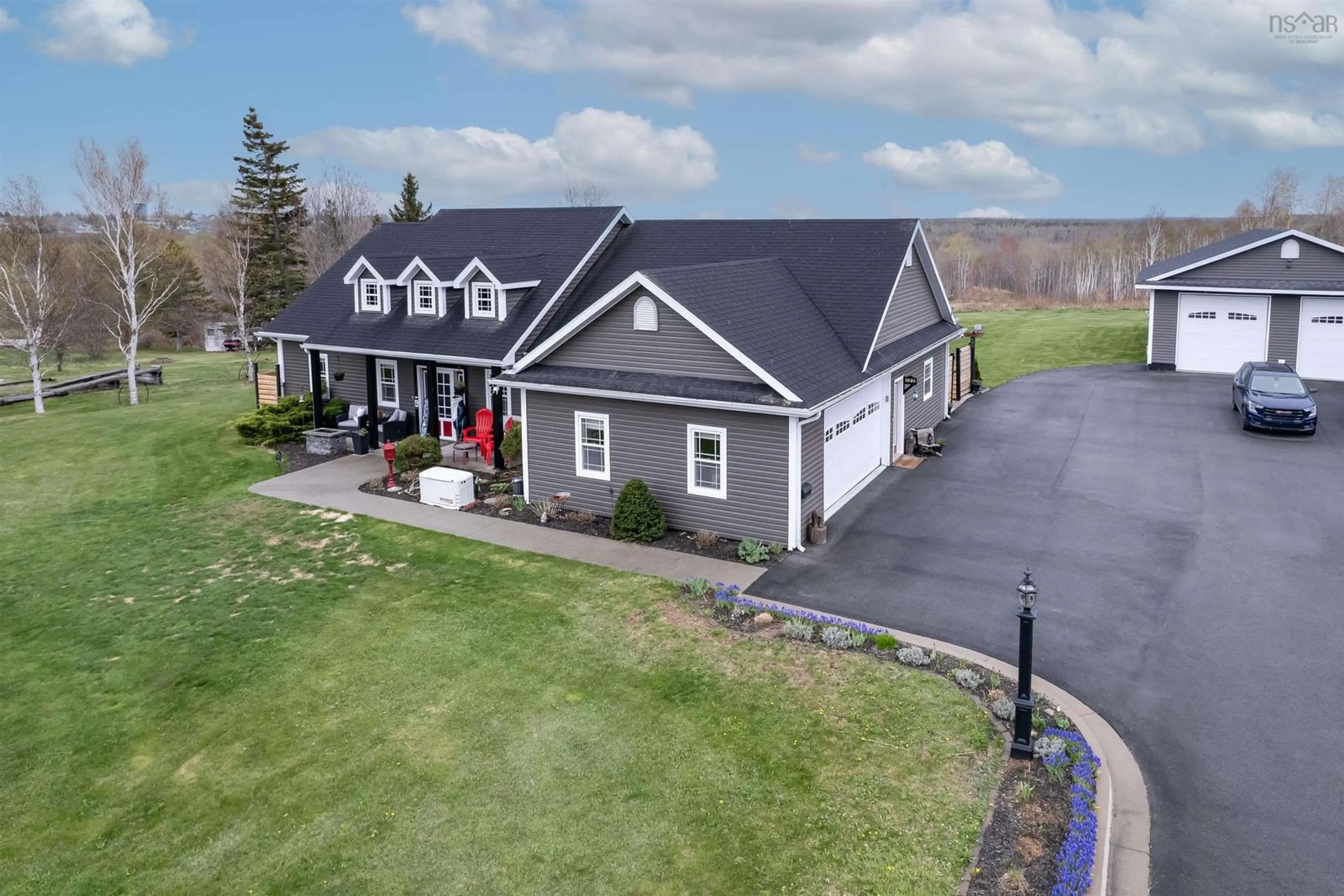 A pic from outside/outdoor area/front of a property/back of a property/a pic from drone, unknown for 102 Kaneville Road, New Victoria Nova Scotia B1H 5T1