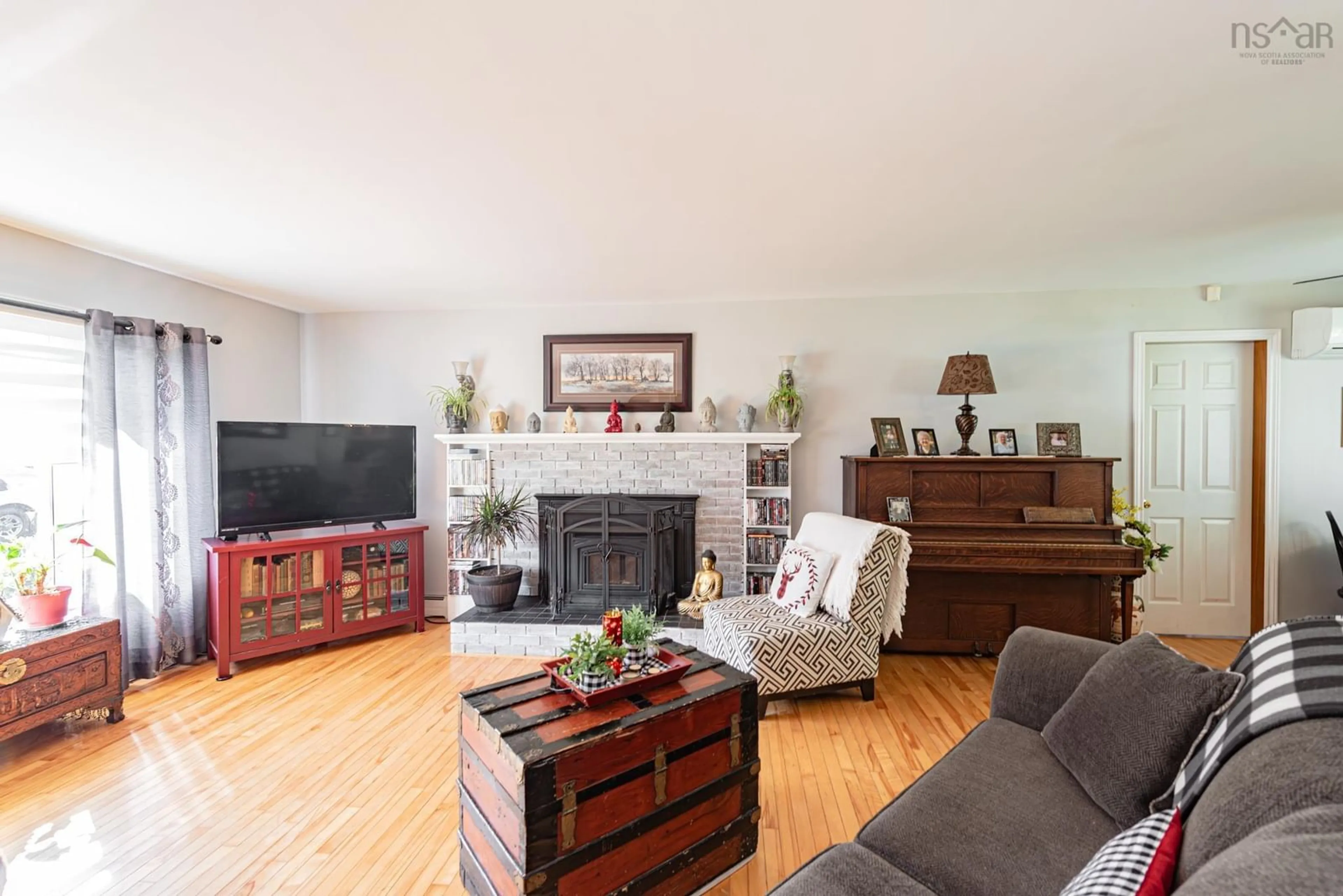 Living room with furniture, wood/laminate floor for 4 Three Brooks Rd, Three Brooks Nova Scotia B0K 1H0