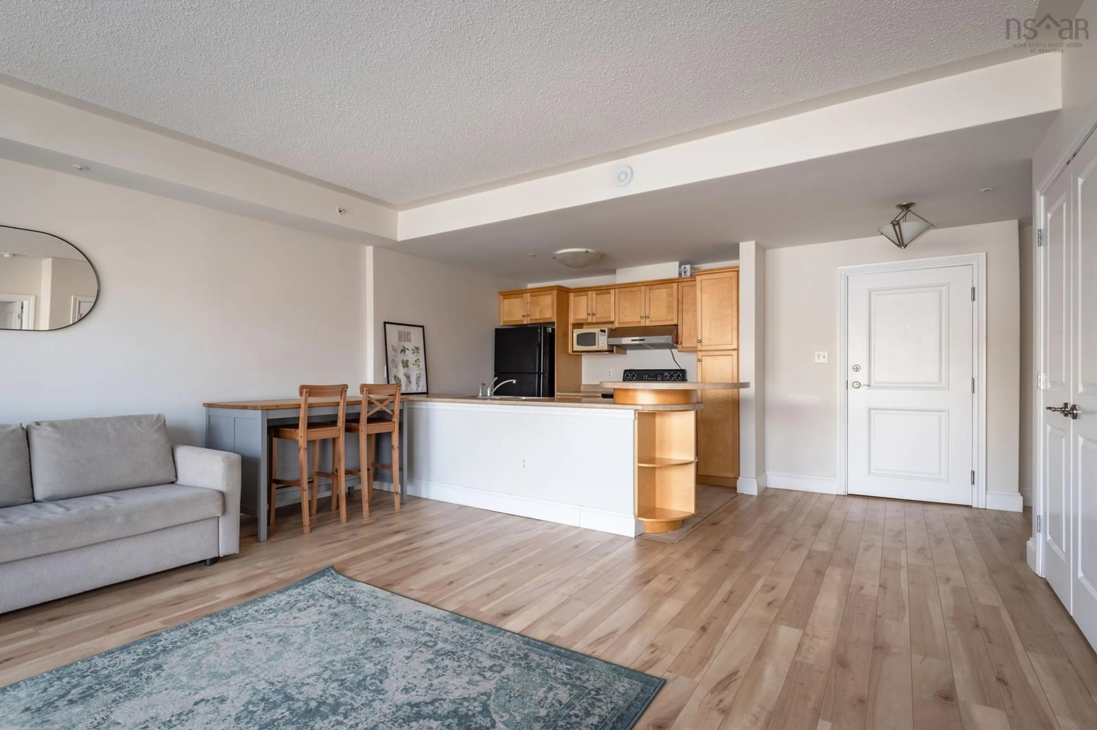 Open concept kitchen, wood/laminate floor for 647 Bedford Hwy #208, Halifax Nova Scotia B3M 0A5