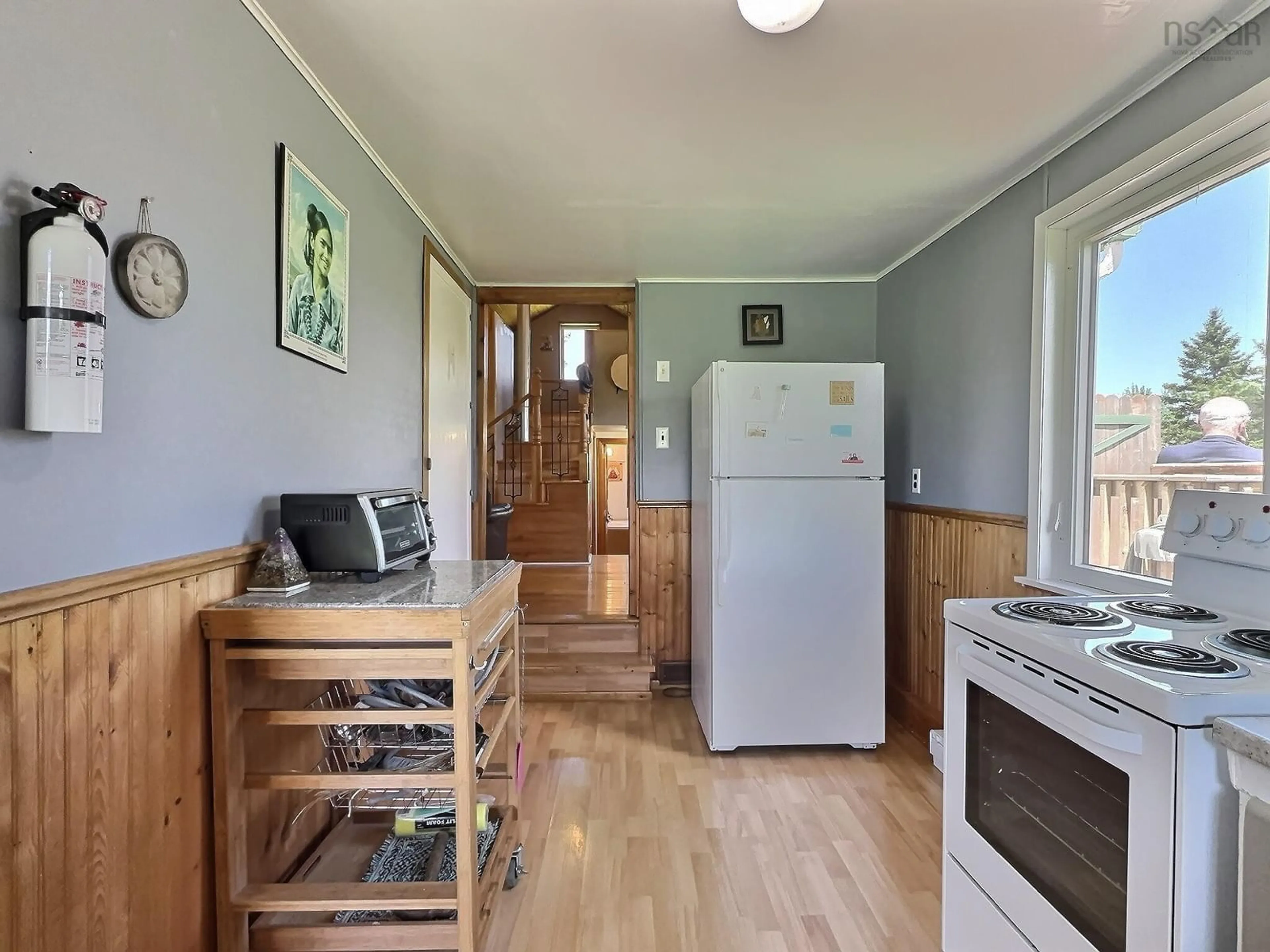 Kitchen with laundary machines, wood/laminate floor for 1922 Upper River John Rd, Middleton Nova Scotia B0K 1N0