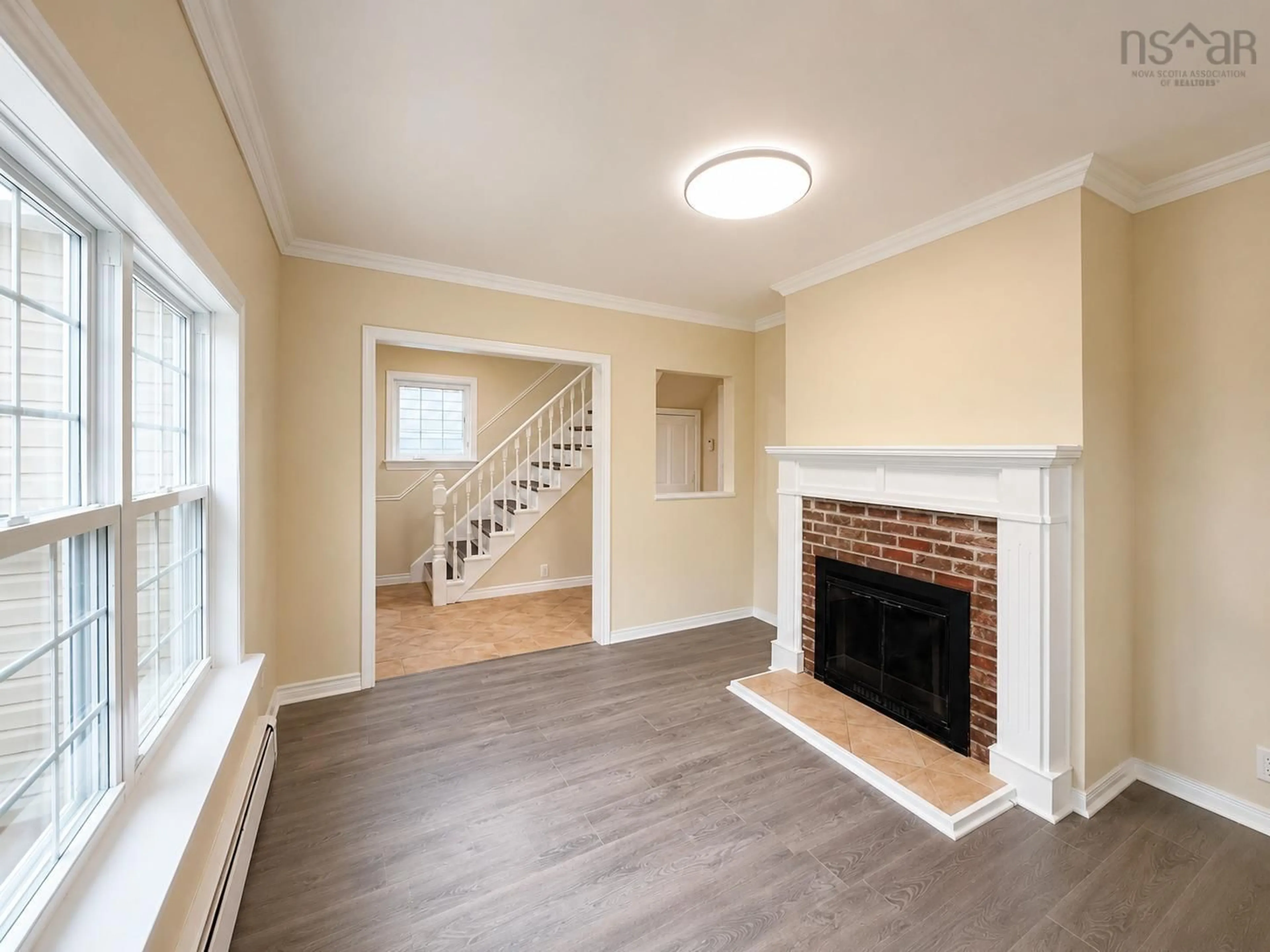 Living room with furniture, wood/laminate floor for 446 Whitney Ave, Sydney Nova Scotia B1P 5A7