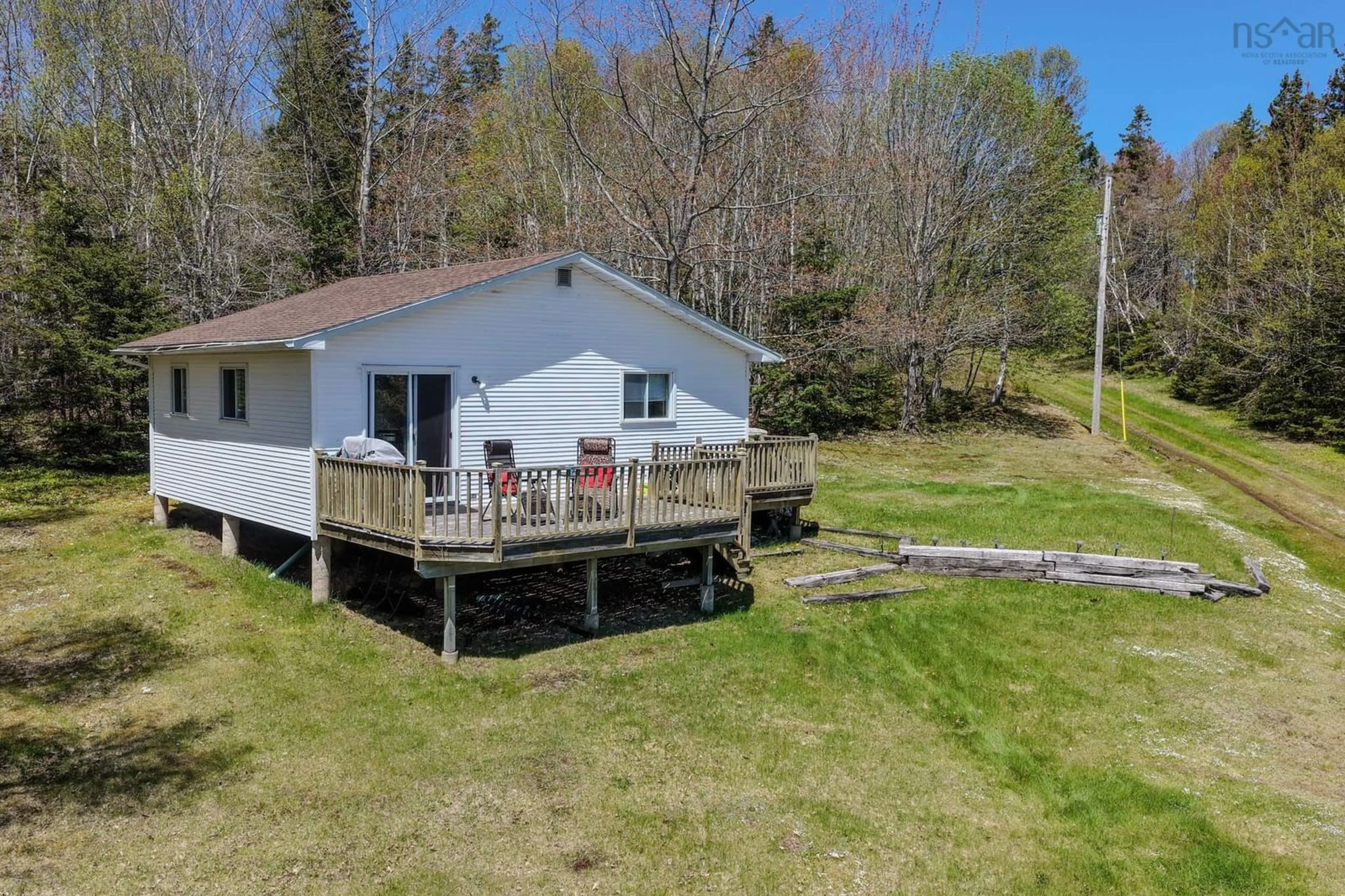 A pic from outside/outdoor area/front of a property/back of a property/a pic from drone, water/lake/river/ocean view for 81 Maceachern Rd, North Side East Bay Nova Scotia B1J 1E4