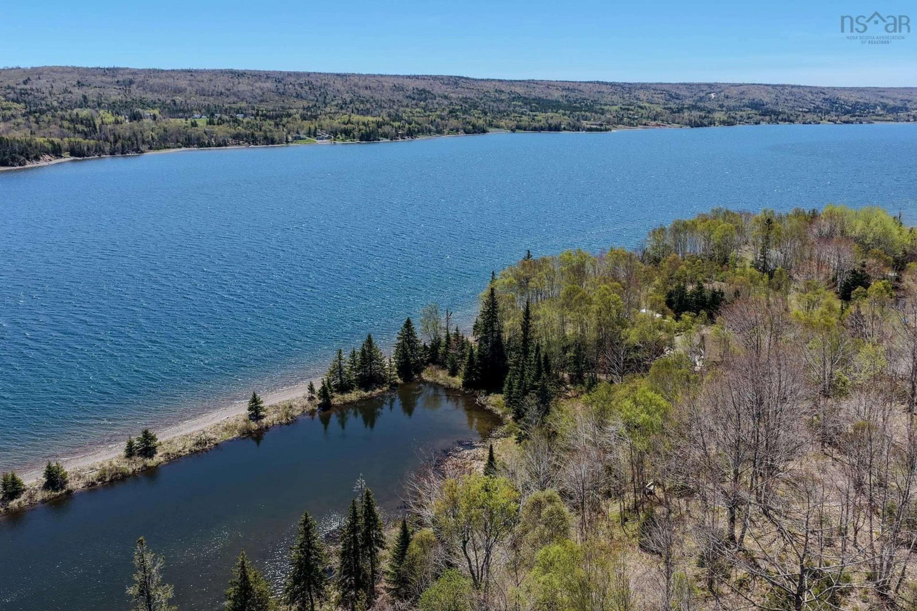 A pic from outside/outdoor area/front of a property/back of a property/a pic from drone, water/lake/river/ocean view for 81 Maceachern Rd, North Side East Bay Nova Scotia B1J 1E4