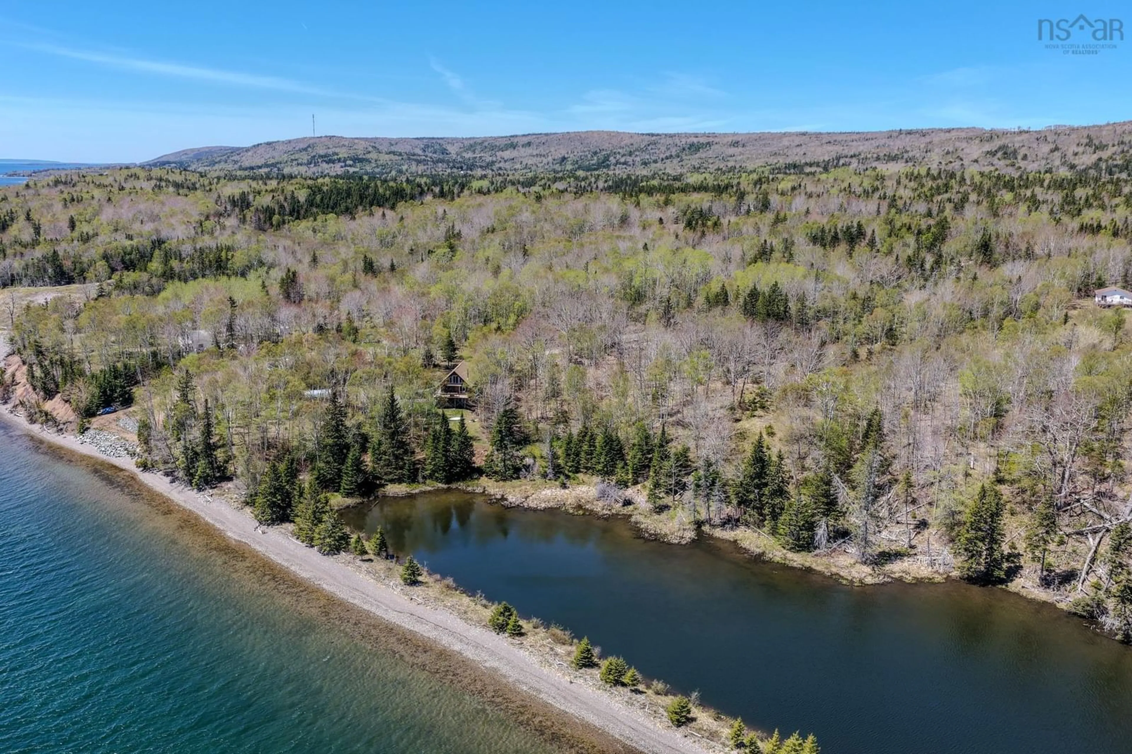 A pic from outside/outdoor area/front of a property/back of a property/a pic from drone, water/lake/river/ocean view for 81 Maceachern Rd, North Side East Bay Nova Scotia B1J 1E4
