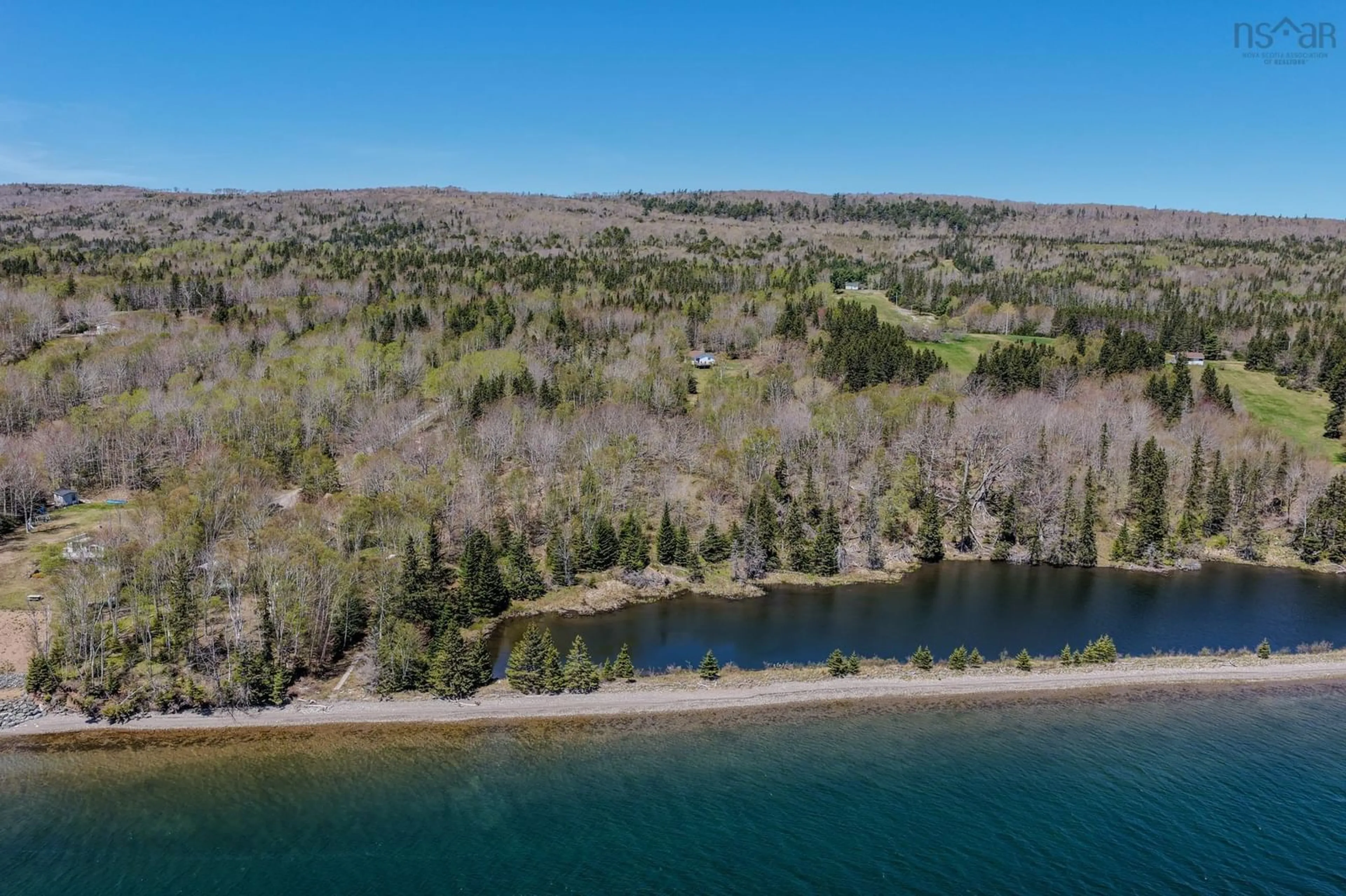 A pic from outside/outdoor area/front of a property/back of a property/a pic from drone, water/lake/river/ocean view for 81 Maceachern Rd, North Side East Bay Nova Scotia B1J 1E4