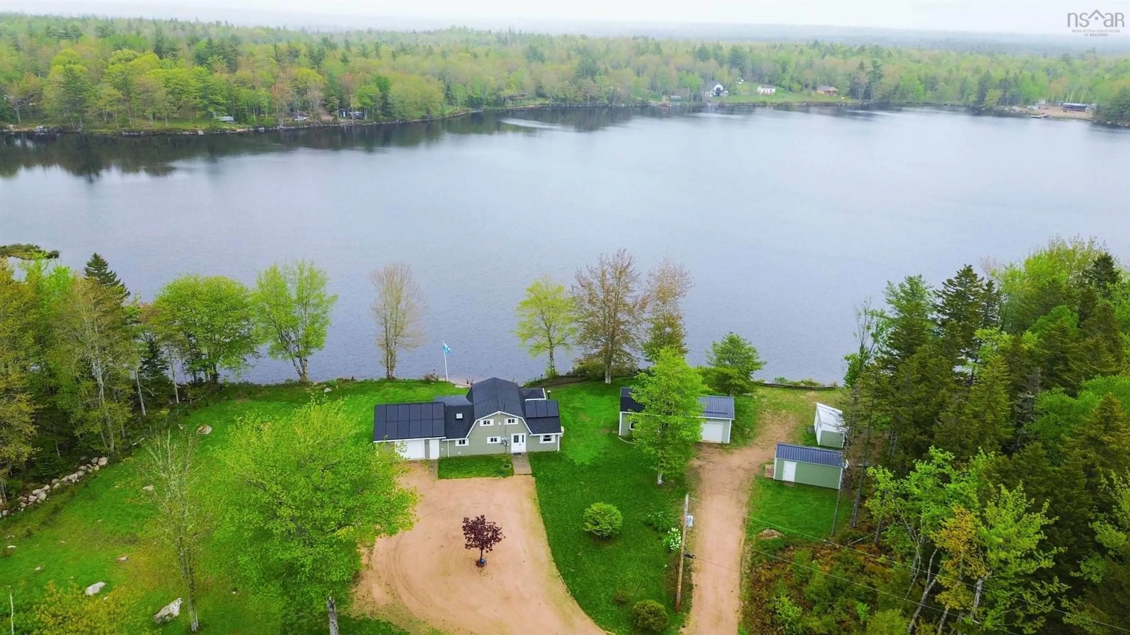 A pic from outside/outdoor area/front of a property/back of a property/a pic from drone, water/lake/river/ocean view for 244 East Lake Rd, New Albany Nova Scotia B0S 1P0