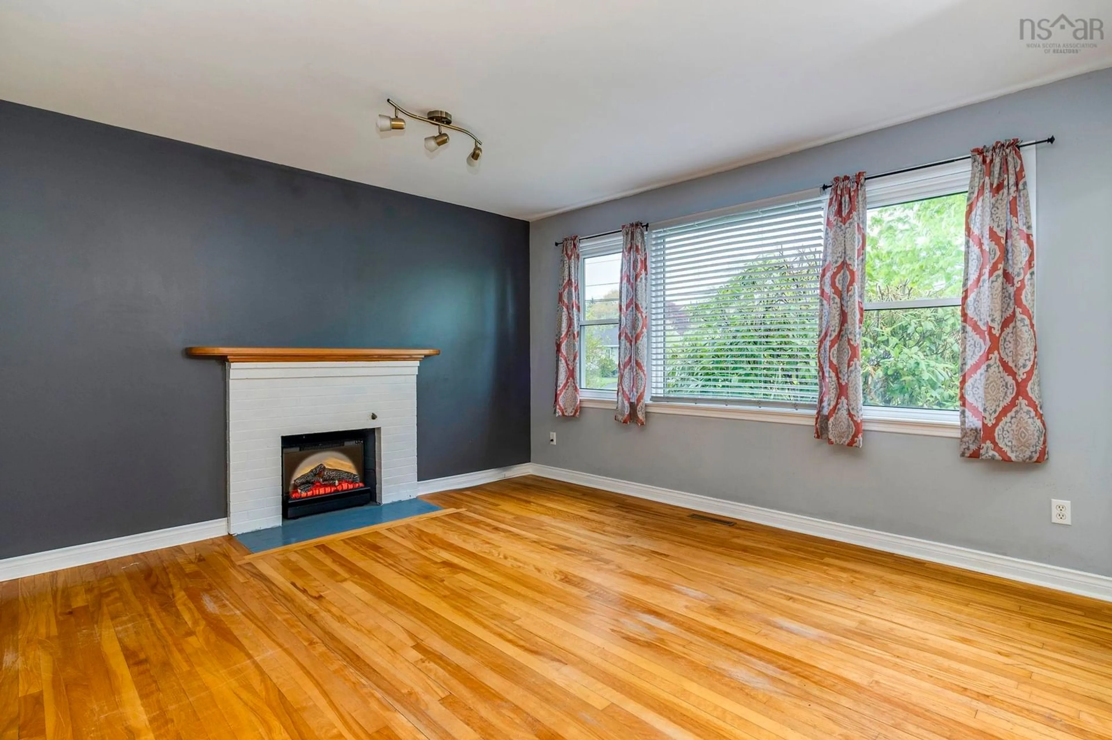 Living room with furniture, wood/laminate floor for 32 Farquharson St, Dartmouth Nova Scotia B2W 1T3