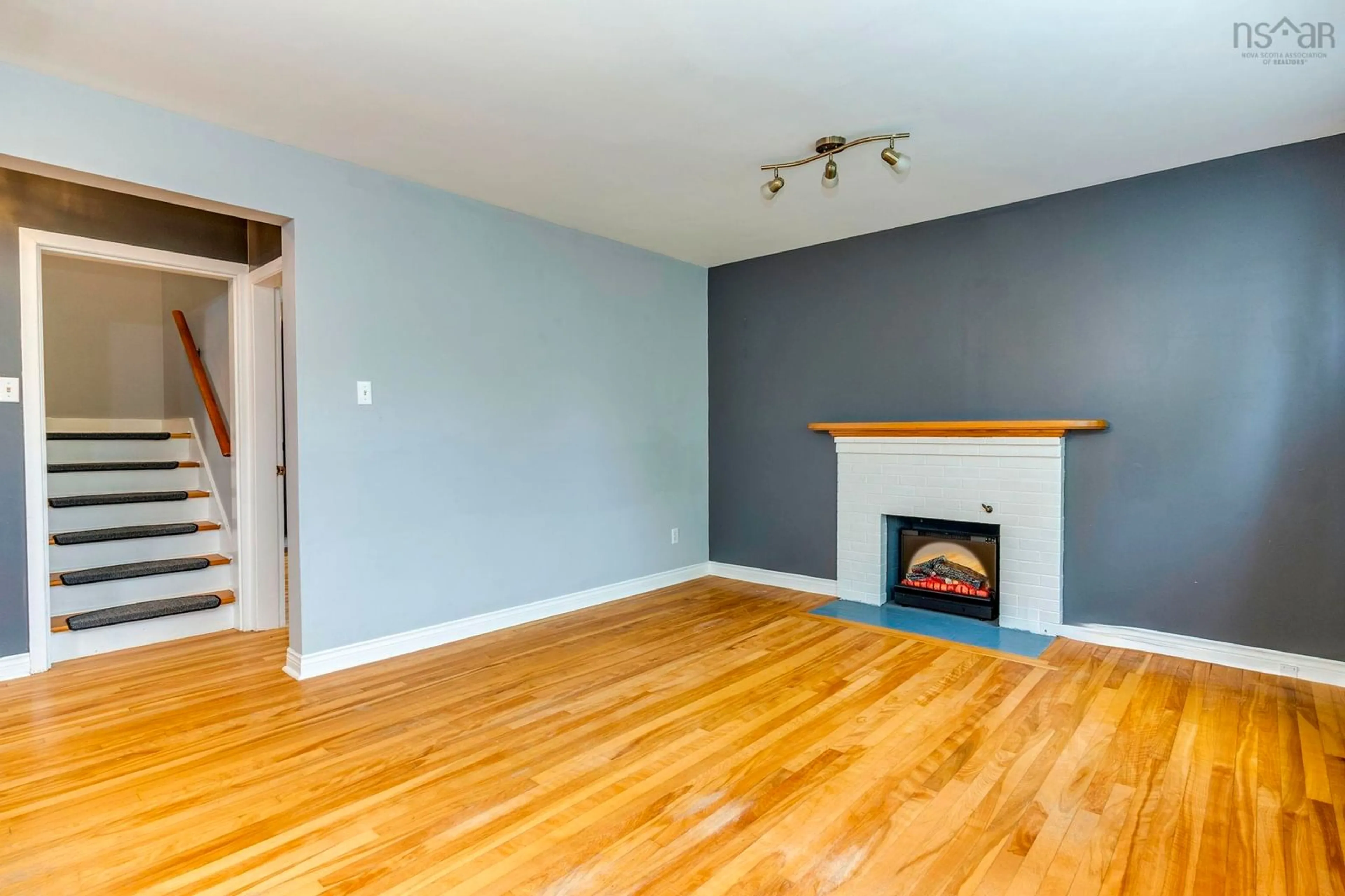 Living room with furniture, wood/laminate floor for 32 Farquharson St, Dartmouth Nova Scotia B2W 1T3