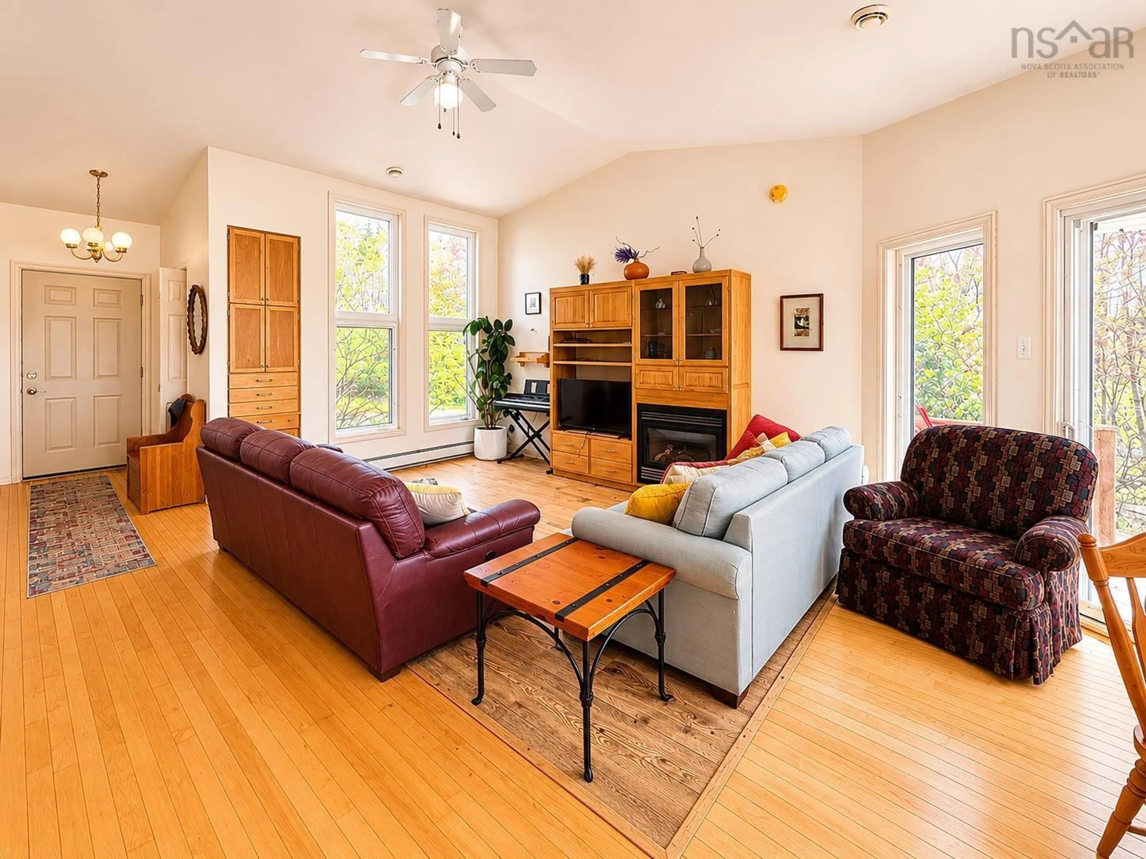 Living room with furniture, wood/laminate floor for 10797 Highway 105, Aberdeen Nova Scotia B0E 3M0
