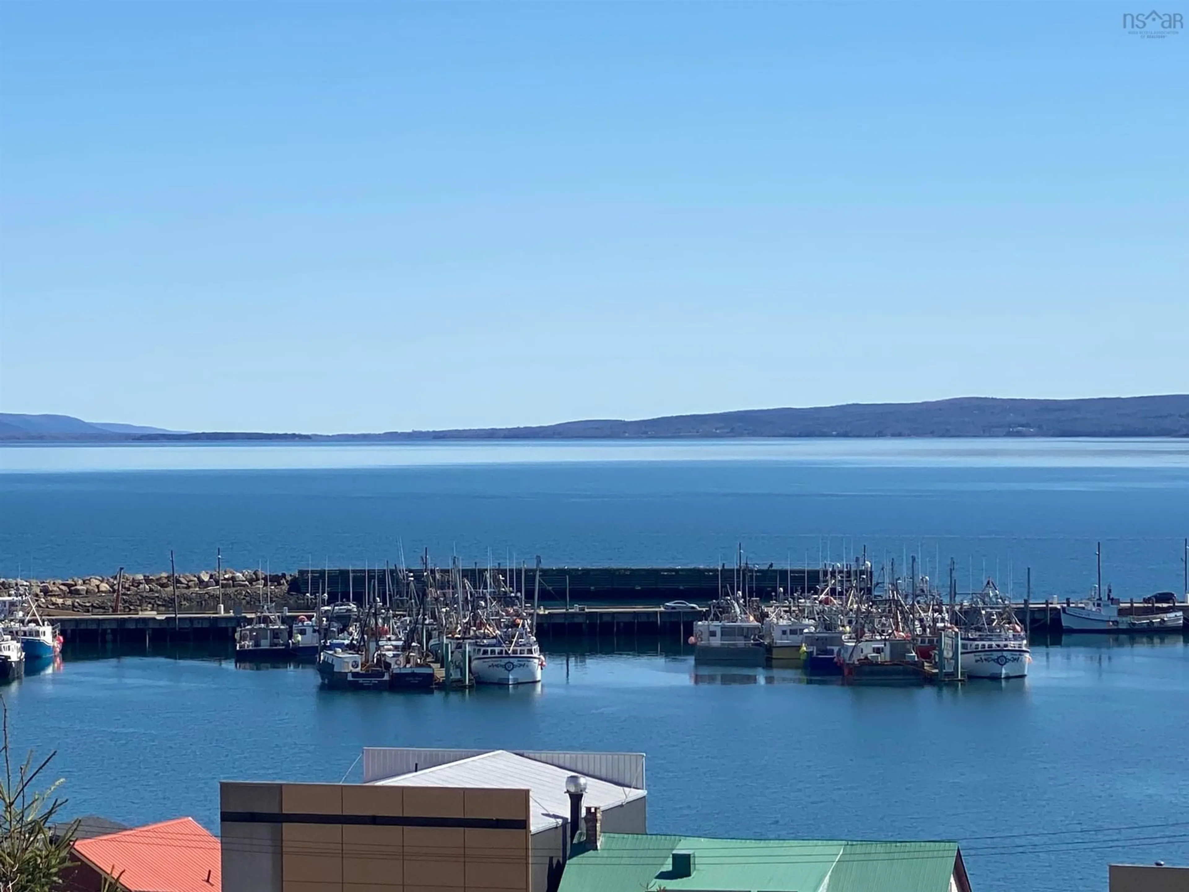 A pic from outside/outdoor area/front of a property/back of a property/a pic from drone, water/lake/river/ocean view for 140 Queen St, Digby Nova Scotia B0V 1A0