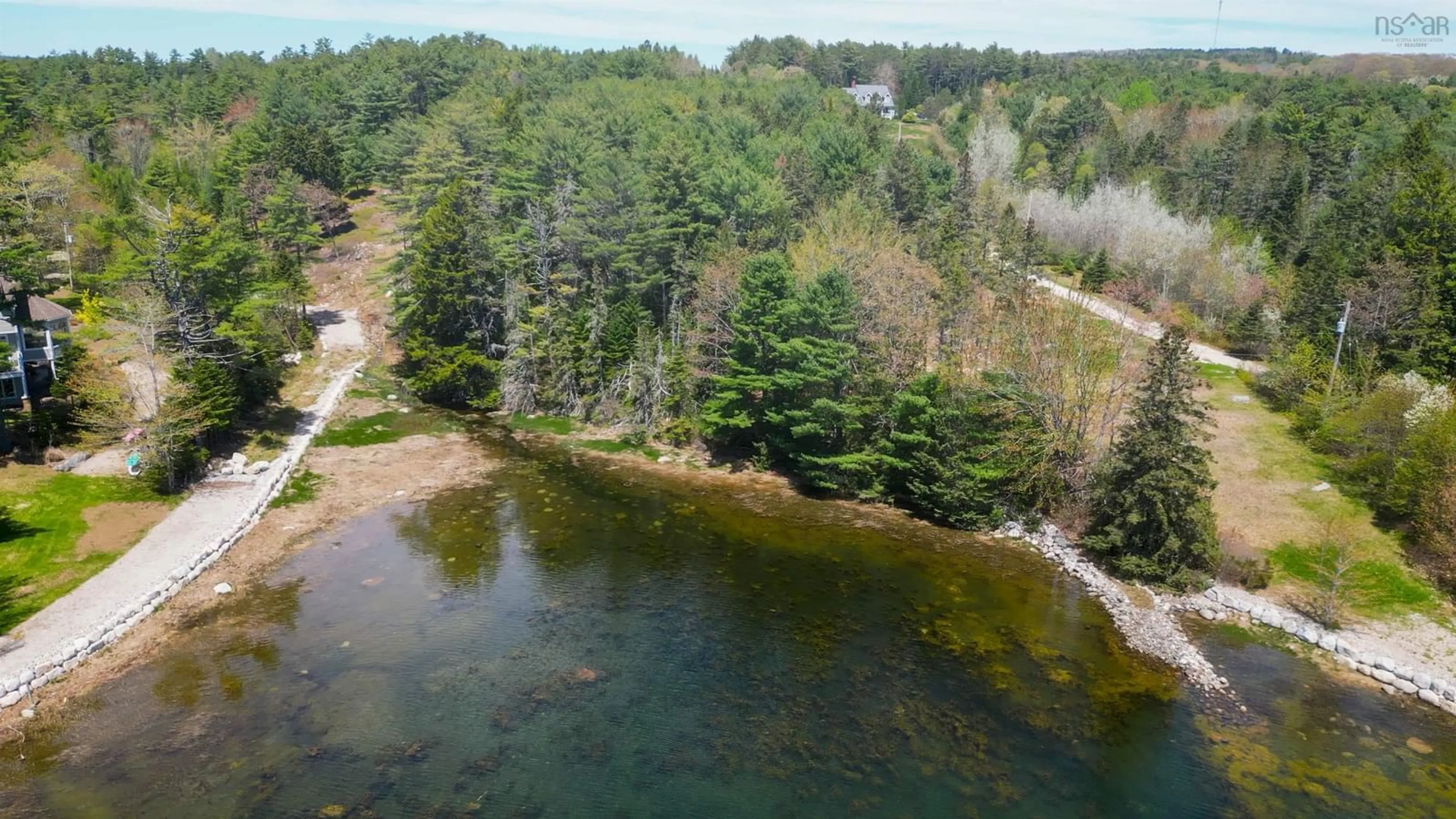 A pic from outside/outdoor area/front of a property/back of a property/a pic from drone, water/lake/river/ocean view for 41 Eisnor Rd, Marriotts Cove Nova Scotia B0J 1K0