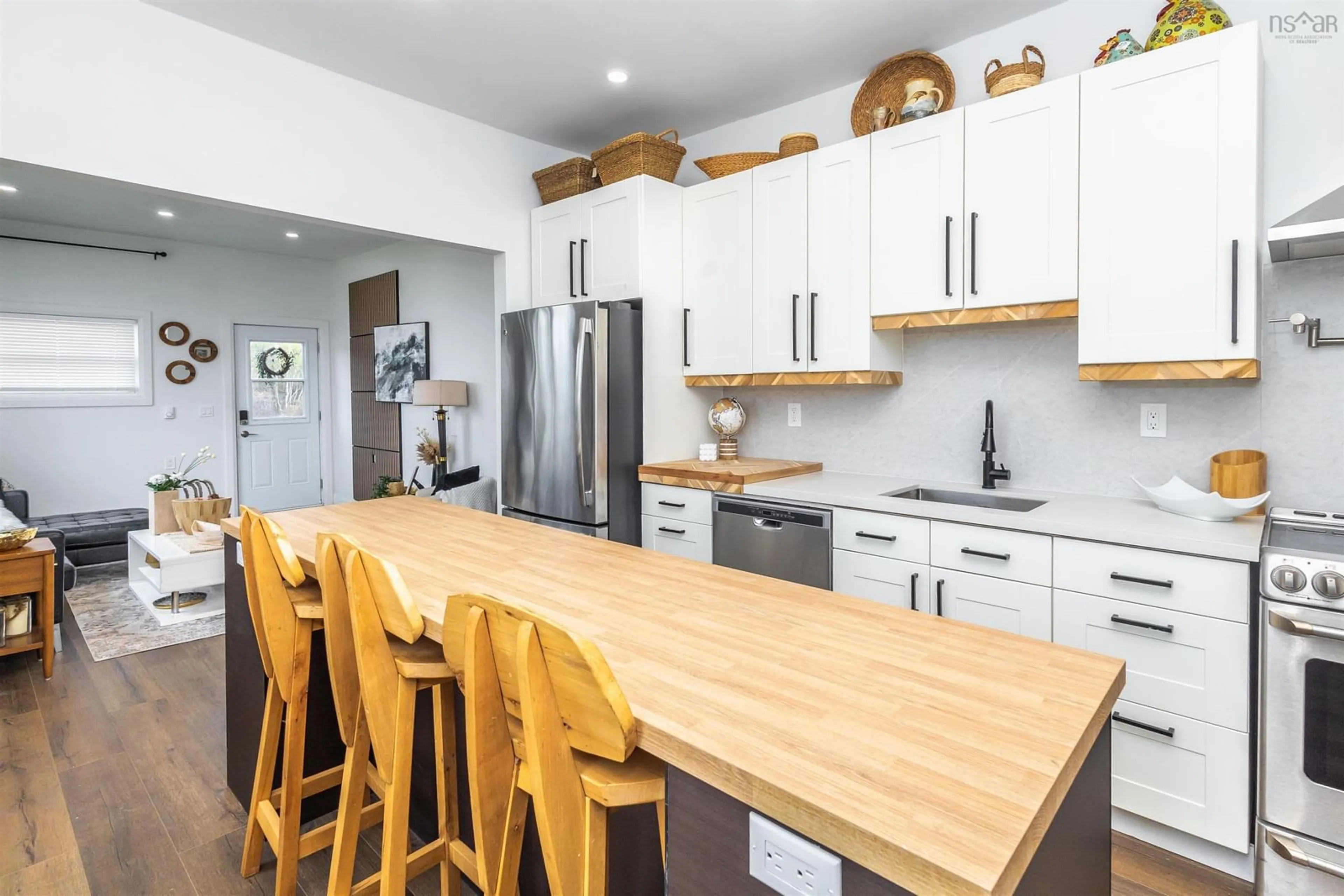 Open concept kitchen, wood/laminate floor for 3749 New Waterford Hwy, New Victoria Nova Scotia B1H 5B8